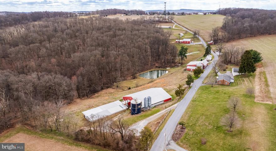 *Income Producing Farm ALERT* This 10+ acre farmette is packed with potential! 2 Dwellings, 3 Barns, oversized detached garage, .5  acre pond, and 5  acres under pasture. The 1,300sf  3bd 1ba rancher, and the 900sf  2bd 1ba farm house both provide great space to live, live in one and rent the other out (or rent both), make one your office, or establish the family compound- The future is yours to decide! Rancher has been meticulously maintained with newer roof and windows. Farm house recently renovated and turn key, too! The 90'x75' barn is a turn key pig (500  heads) operation with potential for poultry with some minor adjustments- immediate income potential. The pig barn has a bonus 80'x40' barn behind it that isn't as turn key. The 70'x60' Bank barn has stalls for your horses or livestock, and a large upper level for storage. The 100'x50' combine barn comfortably fits a combine or plenty of space to store or whatever else you need all of that space for! 40'x40' detached garage with tall garage doors. Pond is stocked with large bass and other fish. And plenty of pasture for your horses and/or livestock. NOT MUCH TILLABLE GROUND. This farm has endless opportunities, while being very private it's close to major MD and Harrisburg commuter routes! Clean & Green. It's not one you want to miss- Schedule your private showing today!! The love and care that's gone into this property will impress you. ***More rancher photos coming soon!***Property will be active for showings 3/20/2026***