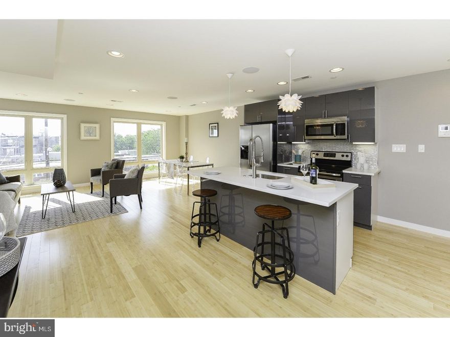 New Construction Condo in the BOOMING Fairmount/Francisville Neighborhood. This property is located just a few feet from Fairmount Avenue and is surrounded by new development. Enjoy a short walk to the Fairmount/Francisville's commercial district on Fairmount Ave which is filled with shops, restaurants, pharmacies, and supermarkets! This unique 1,175 Sqft Bi-level unit offers 2 bedrooms, 2.5 bathrooms. Amenities include: Natural Bamboo Floors, high-end finishes, large windows with plenty of natural light, custom metal railings, surround sound speakers in the ceilings and private roof deck. The first floor of this unit is a large living room perfect for entertaining, a large kitchen complete with beautiful white cabinets, Black Granite countertops, a breakfast bar, and stainless steel appliances. The next floor showcases a large master suite with walk-in closet, private bathroom with custom tiles, glass shower enclosures and a double wide vanity. This floor also includes the additional bedroom with private bathroom, and laundry room. Continue up the stairs to the large fiber glass private roof deck boasting amazing Center City Views. 10 year tax abatement approved. Taxes & Condo fees are estimates.