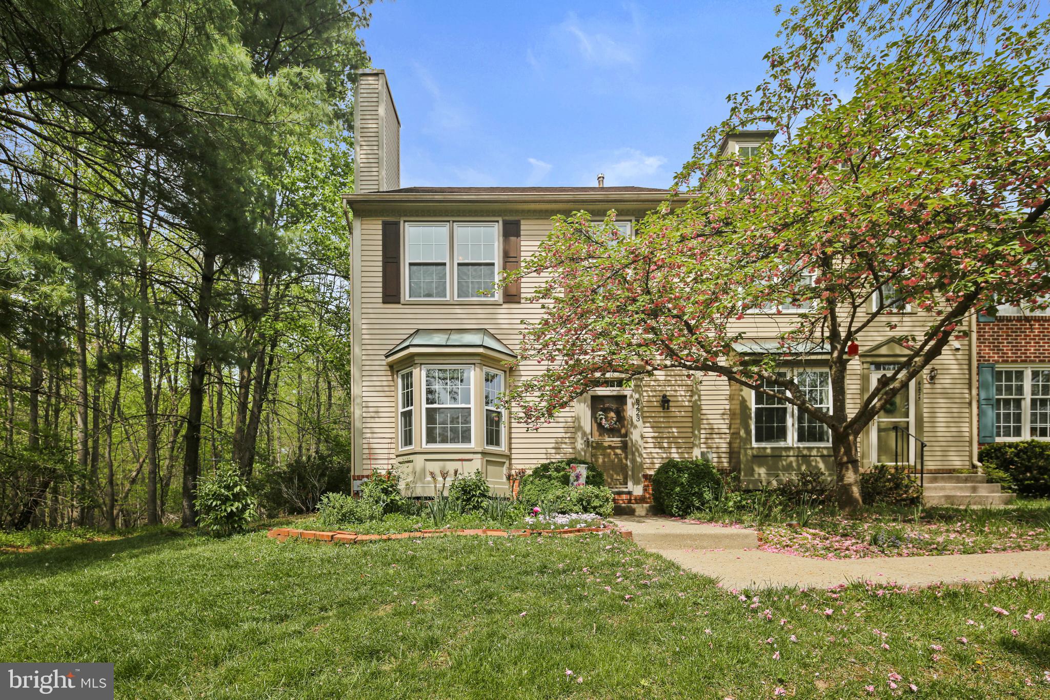 Tucked into the peaceful Willowood community, this beautifully maintained end-unit townhome offers rare privacy with serene wooded views on three sides. Bordered by open community land and adjacent to protected county greenspace, the setting feels like a secluded nature retreat—while still being just minutes from everything you need. Extensive landscaping surrounds the home, creating a natural sanctuary that feels far from the bustle — yet remains close to everything.
Step inside to warm Brazilian cherry hardwood floors and an inviting wood-burning fireplace (gas hookup available). A charming bay window floods the space with natural light. An expansive dining area also offers panoramic views of the surrounding trees.
The kitchen boasts glass-front oak cabinetry with sleek stainless steel hardware, Silestone countertops, a custom tile backsplash, and a gas range. A glass slider, off the large eat in area, leads to the expansive deck, surrounded by lush gardens and mature trees. An open staircase anchors the home’s three levels, adding architectural interest and flow.
Upstairs, the vaulted ceilings create a light, airy feel. The spacious primary suite boasts a walk-in closet, double-sink vanity and a luxurious walk-in shower. All bathrooms have been tastefully upgraded, including both full bathrooms which feature the floors and shower designed with marble style ceramic tile, custom navy vanities with quartz countertops. All adorned with stylish mirrors and lighting. Three closets throughout the home are lined in cedar for added luxury and function.
The open staircase leads to a finished basement with a large laundry and multiple storage areas. New carpet and fresh paint throughout offer a move-in ready experience. A rain barrel system is connected to the roof with a clever overflow design that drains directly into the woods — ideal for eco-conscious watering of flowers and plantings. Additional upgrades include custom cordless shades, a new washer, whole house humidifier, new windows and doors, and roof replaced in 2016. This rare end-unit townhome is a perfect blend of comfort, style, and nature with $133K in upgrades! - a true retreat!