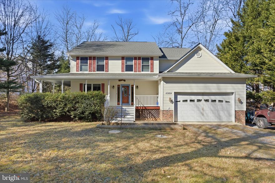 Waterfront Living with Your Own Private Pier at  27245 Cat Creek Rd, where home feels like a getaway every day. Set on a peaceful one-acre lot on Cat Creek just off the Patuxent River, this beautiful Colonial offers direct water access with a private pier in a serene natural setting. While the creek is not visible from the home itself, a scenic walking path leads through the backyard to the water’s edge where the view from the pier opens to the tranquil beauty of Cat Creek, creating the perfect place to kayak, watch wildlife, enjoy peaceful sunsets, or simply relax by the water. The property’s outdoor spaces are designed for both entertaining and quiet enjoyment, featuring composite decking, a covered patio, a charming gazebo-style grilling and gathering area, and plenty of yard space to enjoy nature. Multiple storage sheds provide excellent space for tools, outdoor equipment, kayaks, and recreational gear.
This well-maintained home features 4 bedrooms, 2.5 baths, and a two-car front-entry garage with exceptional curb appeal highlighted by an expansive wraparound front porch and striking double-size stairway. The main level offers hardwood floors, a bright foyer, formal living room, dedicated home office, separate dining room, half bath, and interior garage access. The kitchen anchors the rear of the home with stainless steel appliances, tiled flooring, pantry, pot rack, abundant cabinetry, and a built-in desk overlooking the spacious family room with gas fireplace and backyard access, plus a sunroom filled with natural light and views of the surrounding landscape.
Upstairs, the primary suite features tray ceilings, blackout blinds, walk-in closet, and an ensuite bath with dual-sink vanity, oversized shower with two shower heads, and private toilet closet, along with three additional bedrooms, a full bath with dual vanities, and upper-level laundry. The unfinished basement provides a true blank canvas the drywall is ready for paint and the floor ready flooring, offering tremendous flexibility to create a large recreation room, additional family room, home gym, bedrooms, media space, or whatever best fits your needs.
Showing times are limited, so please schedule early; seller may accommodate additional requests. Conveniently located with access to Routes 235, 5, and 4, offering a reasonable commute to NAS Patuxent River, Andrews Air Force Base, Joint Base Anacostia–Bolling, and major employment centers including Waldorf, Prince Frederick, Solomons, Lexington Park, and the DC metro area.