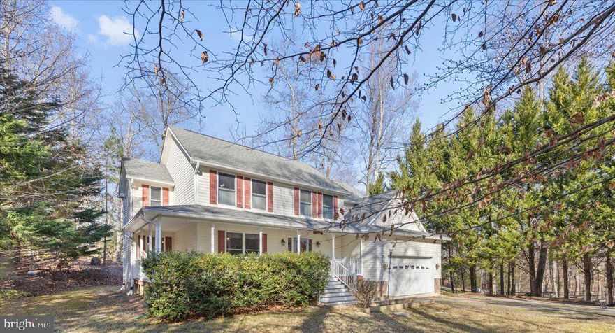 This Colonial on Cat Creek, just off the Patuxent River, offering direct water access with a private pier in a peaceful, one-acre setting surrounded by nature and tranquility. While the creek is not visible from the home, a scenic path leads to the water, making kayaking, wildlife watching, and relaxing by the creek part of everyday life. This well-maintained home features 4 bedrooms, 2.5 baths, a two-car front-entry garage, and exceptional curb appeal highlighted by an expansive wraparound front porch and striking double-size stairway. The main level offers hardwood floors, a bright foyer, formal living room, dedicated home office, separate dining room, half bath, interior garage access, and a rear-anchored kitchen with stainless appliances, tiled flooring, pantry, pot rack, abundant cabinetry, and a built-in desk overlooking the spacious family room with gas fireplace and backyard access, plus a sunroom filled with natural light. Upstairs includes a primary suite with tray ceilings, blackout blinds, walk-in closet, and ensuite bath with dual-sink vanity, oversized shower with two shower heads, and private toilet closet, along with three additional bedrooms, full bath with dual vanities, and upper-level laundry. The finished basement is ready for paint and flooring and offers flexible space to make your own. Outdoor living shines with composite decking, covered patio, gazebo-style grilling area, and a scenic backyard path leading to the private pier on Cat Creek, while additional features include a whole-house generator, three storage sheds, and numerous recent updates detailed in the document section. Showing times are limited. Please schedule early. Seller may accommodate additional requests. Don't miss this one!