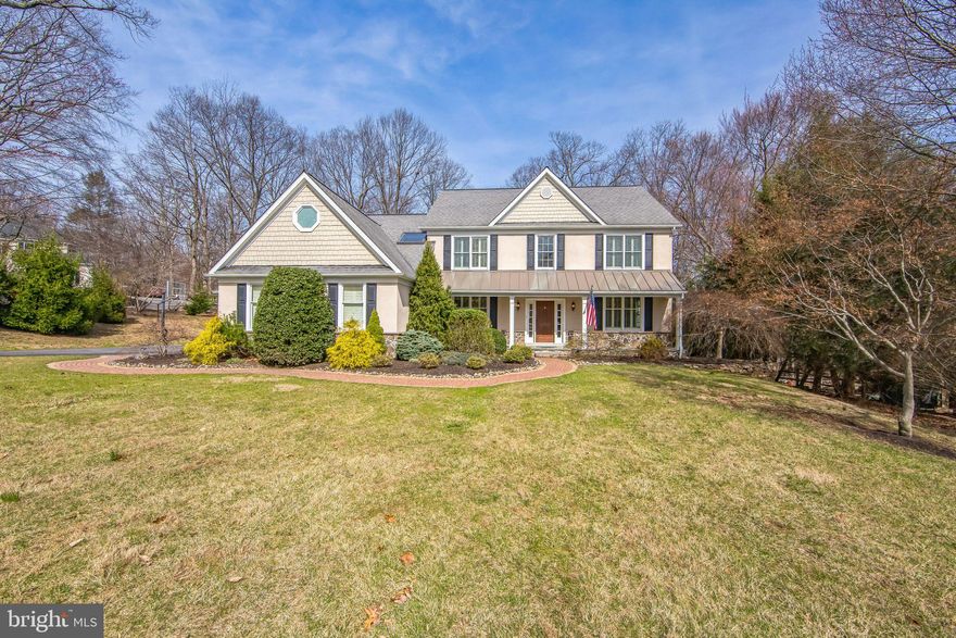 Welcome to a home where elegance meets comfort and every detail tells a story. Nestled in the highly sought-after Brandywine Ridge community this stunning property offers 4 beds with 3 full and 2 half baths. Residing on 6.2 acres in the West Bradford township full of character with detailed custom stone finishes and extensive landscape. A custom paver walkway welcomes you to a covered porch entryway. The  grand two story foyer has an oversized chandelier finished with hardwood floors that flow throughout most levels of this home! Custom millwork adorn the formal living and dining rooms, newly updated light fixtures and plantation shutters that finish these areas. The detailed executive office offers custom bookshelves that surround one of two fireplaces! The heart-of-the-home is the updated kitchen and family great room! Vaulted shiplap covered ceilings and exposed wood beams with recessed lighting create a bright inviting space for you to gather! An oversized black soap stone center island is surrounded by stainless steel appliances and a stunning, commercial grade cobalt blue Hestan gas range accented by a stainless exhaust hood valued at $15k… a chef’s dream! Brilliant white 42” cabinets with under cabinet lighting  plus an added 18” lighted accent cabinet makes for a multitude of storage! A bright inviting space to entertain and enjoy the wood burning fireplace, custom built-in shelving and coffee bar lend an open concept flow for living. A second office or playroom as it is currently used with a side entrance from the two car garage along with a mudroom, laundry and powder room wrap up this first level. The second level primary suite with sitting room and two large oversized custom built in closets lead to a beautiful white en-suite bath. Dual vanities, built-in shelving and walk-in shower is completed with a sunken tub to relax and get away from a long day! The second bedroom has a gorgeous en-suite with a custom tiled shower and granite covered vanity. As well an updated hall bath offers dual sinks and walk-in white subway tiled shower for bedrooms three and four to complete this level. A glass paned door leads you to the lower walk-out level. Entertain your friends and family in this large open space. A bar, powder room, storage area as well as an added playroom for all to enjoy! The backyard is partially fenced in and offers a gorgeous TimberTek deck to entertain, a Koi pond, fenced in garden and shed.  Surrounded by mature trees and beautiful landscape this property is located in the Downingtown area school district and US News and World report rated #2 in PA STEM School! Centrally located to routes 322, 30 and 113 with wonderful restaurants, shopping and more. Chester County at it’s best!