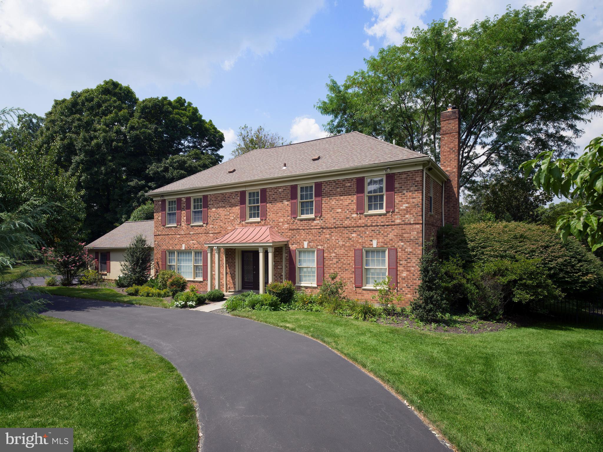 This extensively renovated brick Colonial is located in a highly desirable Penn Valley neighborhood, and is move-in ready condition. Surrounded by mature plantings, the property offers a private, fully fenced rear yard with ample space for gardening, and a gorgeous patio perfect for outdoor entertaining. Spanning over 4,000 square feet and four levels, this home offers 5 bedrooms, 4 1/2 baths, and abundant living space. The sun-filled, contemporary interior spaces feature a neutral color palette, updated lighting, and two gas fireplaces—an electric in the living room and a wood burning in the family room.
The main level features a living room, dining room, powder room and family room where you can gather by the fireplace or enjoy music and TV. The home’s spacious kitchen was completely remodeled in 2018 with custom white cabinetry, granite countertops, and stainless steel appliances, including a LG gas cooktop and refrigerator, and Bosch dishwasher. Adjacent to the kitchen, a bright and inviting sunroom offers radiant heating flooring and large windows overlooking the lush backyard. This sunroom is the perfect place to unwind, whether in the warmth of winter or breezy summer afternoons.
The second floor comprises five spacious bedrooms, each with ample closet storage. Three fully renovated bathrooms are conveniently located on the upper floors, including a primary bedroom suite with a private bath. Additional features include an updated laundry room with a high-capacity LG washer and dryer, new carpet in the attic and lower level, and closet organizers throughout.
The third floor can function as a home office, playroom, or bedroom, and provides additional storage. The lower level has a full bath and plenty of room for recreation or semi-independent living.
A large two-car garage, recently renovated with new drywall, epoxy flooring, and LED lights, includes an outlet for electric vehicle charging, making it both practical and modernized.
The home has been upgraded throughout, including 2 Air Conditioning/Heating units, 2 hot water heaters, Ecobee thermostats with Alexa capabilities, and a complete roof replacement. The solar-operated blinds in the sunroom skylights, chandeliers in the foyer and dining room provide additional touches of luxury and convenience.
This home is distinguished by its size, modern updates, and beautiful grounds. Its quiet and peaceful location makes it easy to forget how conveniently close you are to everything.