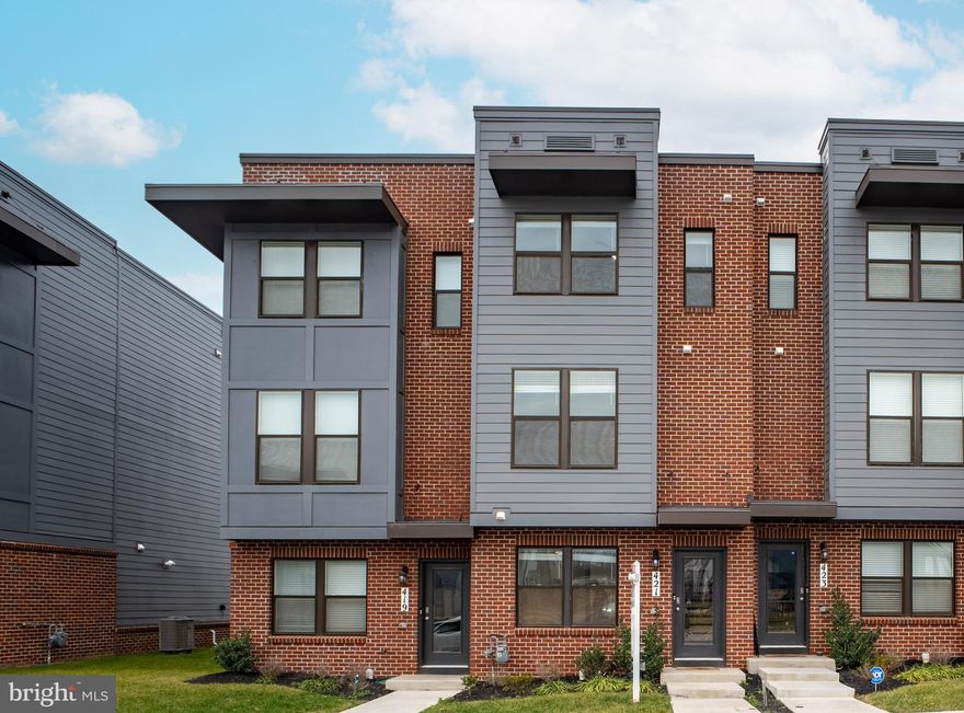 Welcome to this stunning  4-bedroom, 4-(full)bathroom End Unit Townhome. **Located in Renn Quarter, one of the hottest new master planned communities in the City of Frederick, the home is uniquely surrounded by open space and views, away from the crowded rows area. The community amenities include CLUBHOUSE, GYM, SWIMMING POOL and upcoming riverwalk along Carroll Creek connecting to the heart of downtown Frederick. **The urban style Carlton model offers a unique floor plan with FOUR bedrooms and EACH of those suited with its own bathroom. *The entry level bedroom provides convenience - easy fit for an office or guest room, connecting with the rear-end garage. Adorned with LVP flooring, the main level boasts living space with natural lights, accessed with a big deck, and along with an upgraded kitchen with quartz countertop and stainless steel appliances. At the end of the living area, there is the 2nd bedroom and a full bathroom accessed from the common area as well. The upper level has two spacious bedrooms and laundry. The master bedroom suite includes a big walk-in closet. **Almost New.  Available April.  Showings are open now**