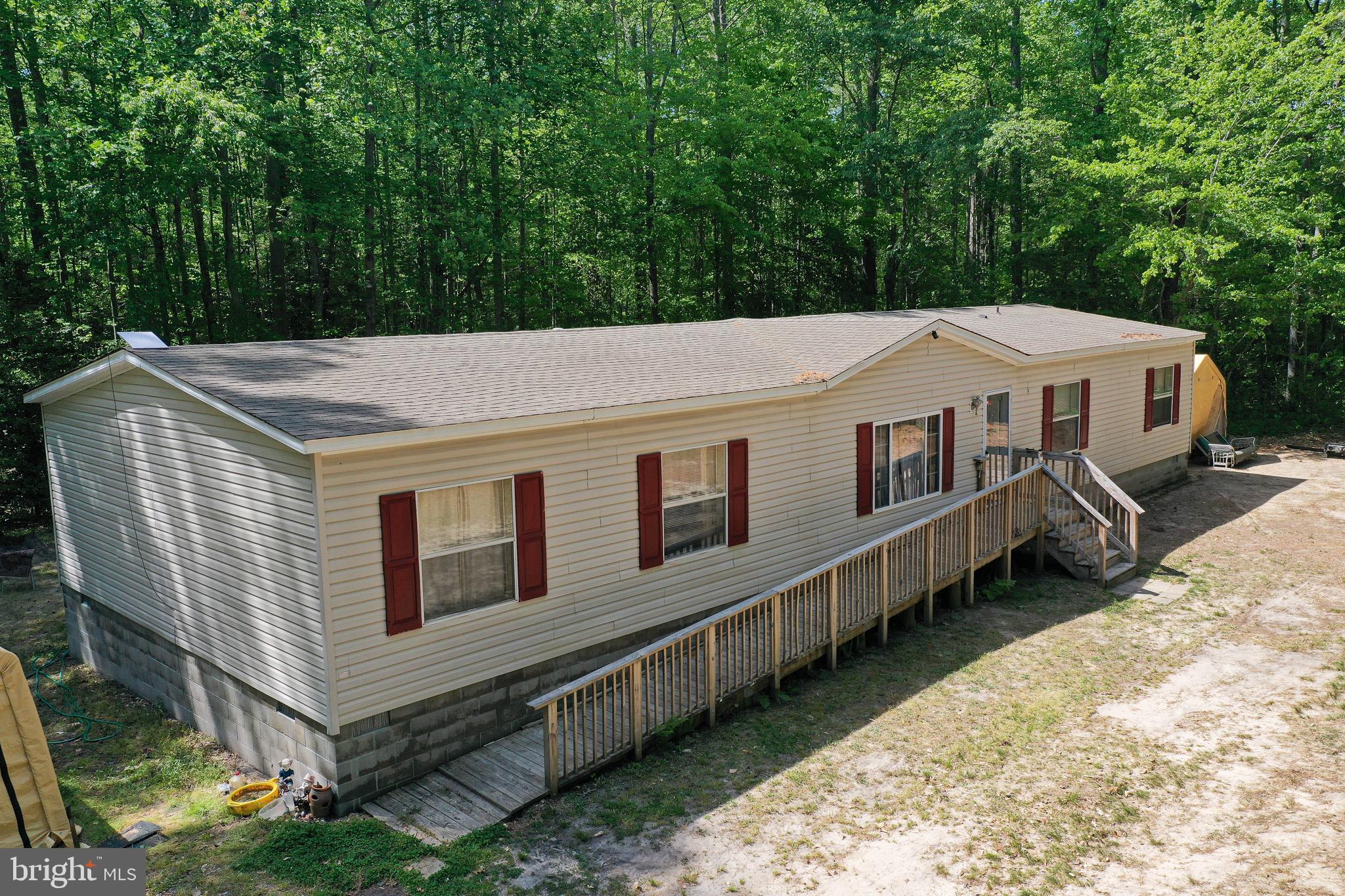 *Unique Opportunity *** 5+ ACRES *** Spacious 4BR + Bonus / 3BA home. Incredible location with tons of privacy - less than 20mi to Ocean City beach and boardwalk, Assateague Island, Salisbury; just 9mi to one of the Top 10 Great American Main Streets and Arts and Entertainment District - Downtown Berlin! Heading back onto the property, you're surrounded by lush, green trees, then the home appears on a large clearing featuring tons of space inside and out to relax, entertain, and enjoy. Large living room opens into the equally large dining / family room. Double-arches into the bright and sunny kitchen with tons of cabinetry, including a pantry cabinet. Utility room w/laundry off the kitchen. Primary bedroom with a private bonus/flex room - office, study, nursery, studio, exercise - walk-in closet, and full, en-suite bath - soaking tub, double-sink vanity, step-in shower stall. Bedrooms 2 and 3 share a full, Jack-and-Jill bath 2. A 4th bedroom and 3rd full bath complete the home's interior. Outdoors is perfect place to be - all year long. Spring/Summer - lounge in the shade or gazebo and listen to the koi-pond's water fountain and breezes through the surrounding trees. Fall/Winter - cozy up around the fire pit. There's nothing else out there like this one! Call today to make this homesteader's dream your own! Sizes, taxes, distances approximate. Although there is an easement to the field behind; seller said no one has used it in many, many years.