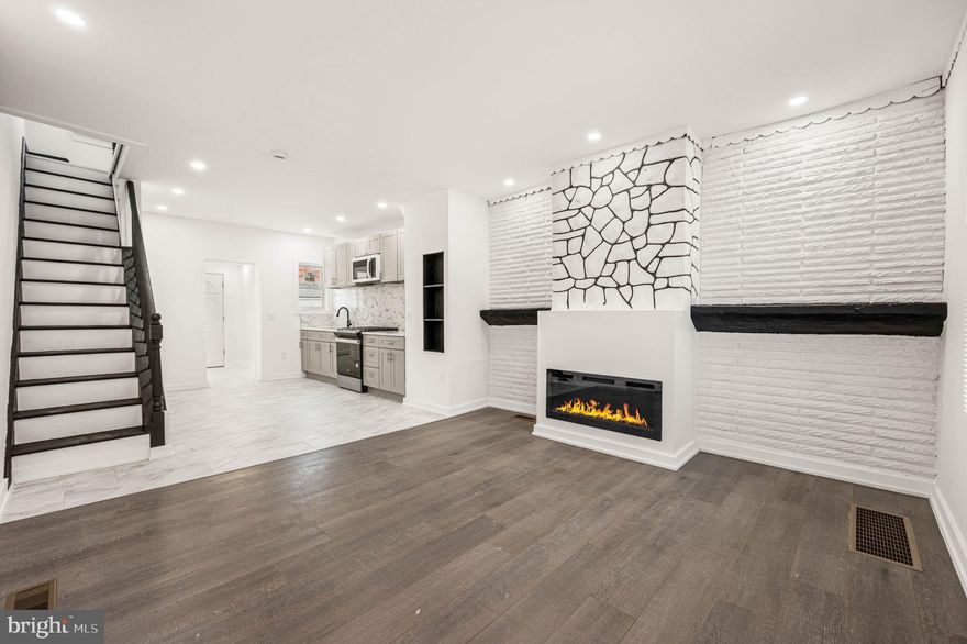 Welcome to 2103 S Daggett Street, a full custom renovation in Southwest Philly where every detail is brand new. This turn-key home offers total peace of mind with a new HVAC system, new energy-efficient windows, and updated plumbing and electrical throughout. The main level features an open-concept living room with hardwood floors, custom molding, and a modern electric fireplace flanked by beautiful built-in shelving. The designer kitchen is equipped with grey shaker cabinets, quartz countertops, and ceramic tile flooring. For added convenience, the first floor includes a dedicated laundry room and a private powder room.

The second floor offers two spacious bedrooms and a full bathroom featuring custom ceramic tile work. The living space continues in the fully finished basement, which includes another full ceramic tile bathroom and a versatile layout perfect for a third bedroom, home office, or gym. Located with easy access to University City, local shopping, and public transportation, this home combines high-end custom finishes with functional modern upgrades. Schedule your showing today to see this complete transformation. Brand new roof, brand new rear siding! Everything is new!