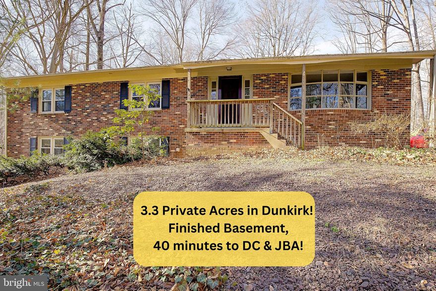 Enjoy the peaceful, rustic feel of nature in this spacious rambler with a full basement, set on a private 3.3-acre wooded lot in sought-after Dunkirk. Surrounded by abundant wildlife—including frequent deer sightings—this property offers true privacy while still enjoying a fantastic north-county location close to shopping, restaurants, and an easy commute to Joint Base Andrews or Washington, DC. This well-built home features three bedrooms on the main level, including a primary suite with a full bath, ceramic tile flooring, and a soaking tub. The walk-out lower level offers a functional fourth bedroom, a third full bath, and flexible living space ideal for extended family, guests, or multigenerational living, with sliding doors providing private access to the side yard. The expansive lower level includes a brick fireplace with a wood-stove insert, making it well-suited for a private living or recreation area and easily adaptable for an in-law or au pair suite. The main level has been freshly painted and features new carpet, along with original hardwood floors. The kitchen is well-appointed with granite countertops, stainless steel appliances, a gas range, and custom cabinetry, opening to a large country-style kitchen and dining area—perfect for gathering multiple generations. Additional living space includes a living room and separate family room with French doors leading to the deck, overlooking the serene wooded acreage. Major updates include replacement windows, a roof installed approximately 10 years ago (2012), and a new drain field installed in 2005. A rare opportunity to enjoy privacy, flexibility, and space for multigenerational living—all in one beautiful setting!