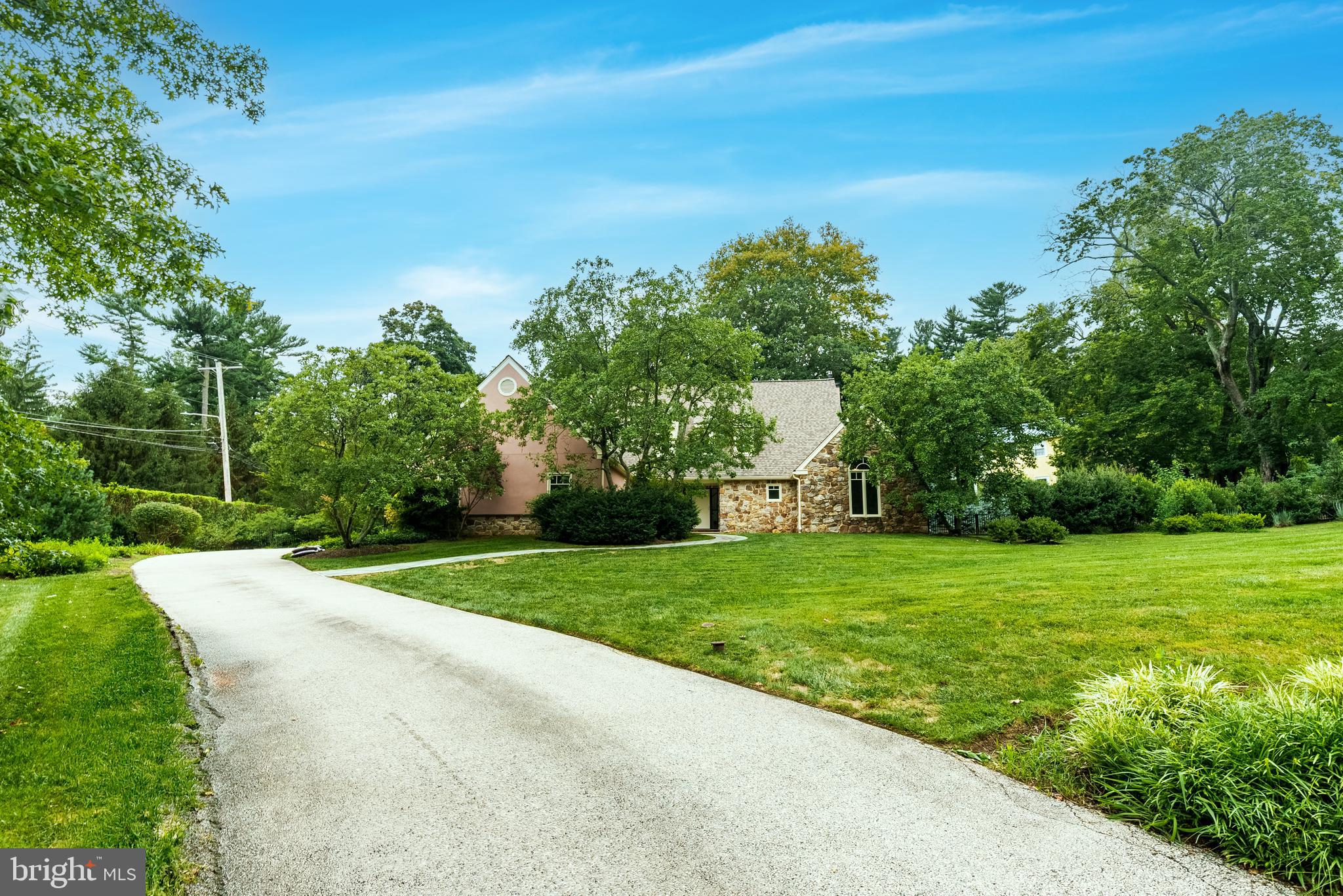 Expanded, renovated and elegant Haverford retreat with two primary suites available in time for the upcoming school year! This masterfully renovated home is a stone's throw from Merion Golf Club and it has been outfitted with nothing but the finest selections and craftsmanship from top to bottom. On the main floor you'll be delighted to find a gourmet chef's kitchen that opens up to the first of two living rooms - both of which have fireplaces. Adjacent to this space there's a formal dining area that leads you into the second living room. You can easily access the expansive backyard, rose garden, and recently added luxury jacuzzi from multiple different locations on the first floor. In the front of the home on the main floor is the first of two large primary suites, allowing you the opportunity to choose which location meets your desires and lifestyle needs. Upstairs you'll find the second primary suite along with 2 more bedrooms that share a very well appointed bathroom, again with top of the line finishes. Both primary suites include dual sinks, Albert and Victoria bath tubs, and oversized walk in closets. This home also boasts plenty of storage space with its large basement and finished attic over the second floor and garage areas. Peace, comfort, and luxury abound in this gorgeous property that has been well designed and immaculately maintained. It also has a newer roof, windows, and stucco to ensure the home is well protected. Opportunities to own a masterpiece like this in close proximity to the Main Line's finest offerings in cuisine, schooling, and recreation are hard to come by - this is your chance!