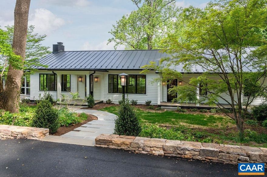 Completely renovated like-new contemporary home in the highly desired neighborhood of Bellair! This home has just been entirely remodeled & finished and is ready for occupancy! Main level features an open floor plan, surrounded by large windows to take in the beautiful pastoral setting, including views of the community pond, Birdwood Golf Course, Boars Head Inn, and all the way to the Blue Ridge Mountains. There are 4 total bedrooms - primary on the main level, 3.5 sparkling-new bathrooms, and a great room with vaulted beamed ceiling soaring to 16 feet. Superb construction, use of quality materials, and exquisite finish details are trademarks of Master Builder, Baird Snyder. Other features include a generous screened porch off the great room (with fireplace) to enjoy the superb natural setting and views from this elevated 5.46 acre homesite. There is a large open yard, wooded areas and a creek, plus a community pond just across Old Farm Road. The residence is surrounded by lovely gardens and plantings, stone hardscape, and numerous large trees.  Inside are great contemporary living spaces with plenty of cabinetry and a magnificent gourmet kitchen for cooking and entertaining!,Painted Cabinets,Soapstone Counter,White Cabinets,Wood Cabinets,Exterior Fireplace,Fireplace in Great Room