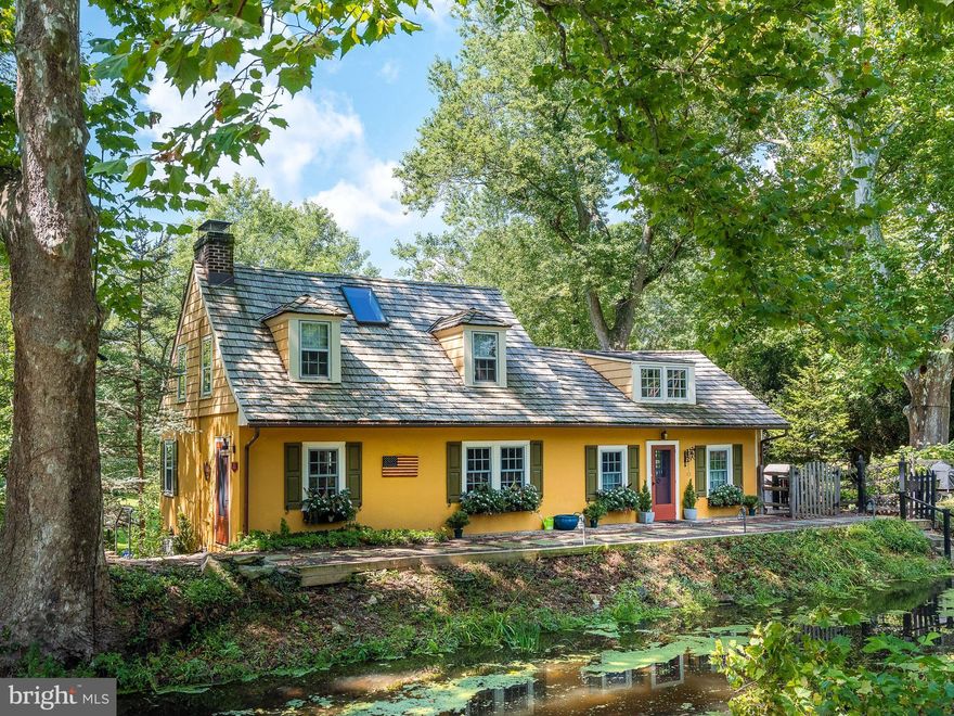 Pumpkin Seed Reimagined:
This iconic 1800's antique home along the bank of the Delaware Canal, named by the famous Impressionist Mary Elizabeth Price, is now available for its next steward. Featuring hardwood floors, romantic scenery, and direct canal path access, this brilliantly maintained turn-key home truly embodies the classic Bucks County lifestyle. The light-drenched kitchen has been redesigned, showcasing a central island with magnificent stone countertops, generous built-in storage, a farmer’s sink, and an impressive Wolf commercial range stove, all with easy access to the outside deck, hot tub & lush garden.  The European-inspired patio area is perfect for effortless outdoor dining & entertaining.  Back inside, the comfortable living room exudes endless charm, featuring exposed beam ceilings, a wood-burning fireplace, and lovely views. There are three very private bedrooms, one on each level, all with en suite modern bathrooms. The primary bedroom suite is especially elegant, with vaulted ceilings, a fabulous bathroom, and an office/reading nook for unwinding. Additionally, the lower level has been newly renovated, featuring plenty of space for an office, gym or bedroom.  Brand new mechanical systems as well as a whole house generator have also been added. Each enhancement has been completed with the utmost craftsmanship, reflecting the timeless nature of the property. Providing endless opportunities for hiking, fishing, biking, and related naturalist pursuits, this home’s towpath-access makes strolling into the vibrant towns of New Hope and Lambertville a breeze. Come and experience total serenity at "Pumpkin Seed"; the perfect little country getaway, the perfect place to call home.