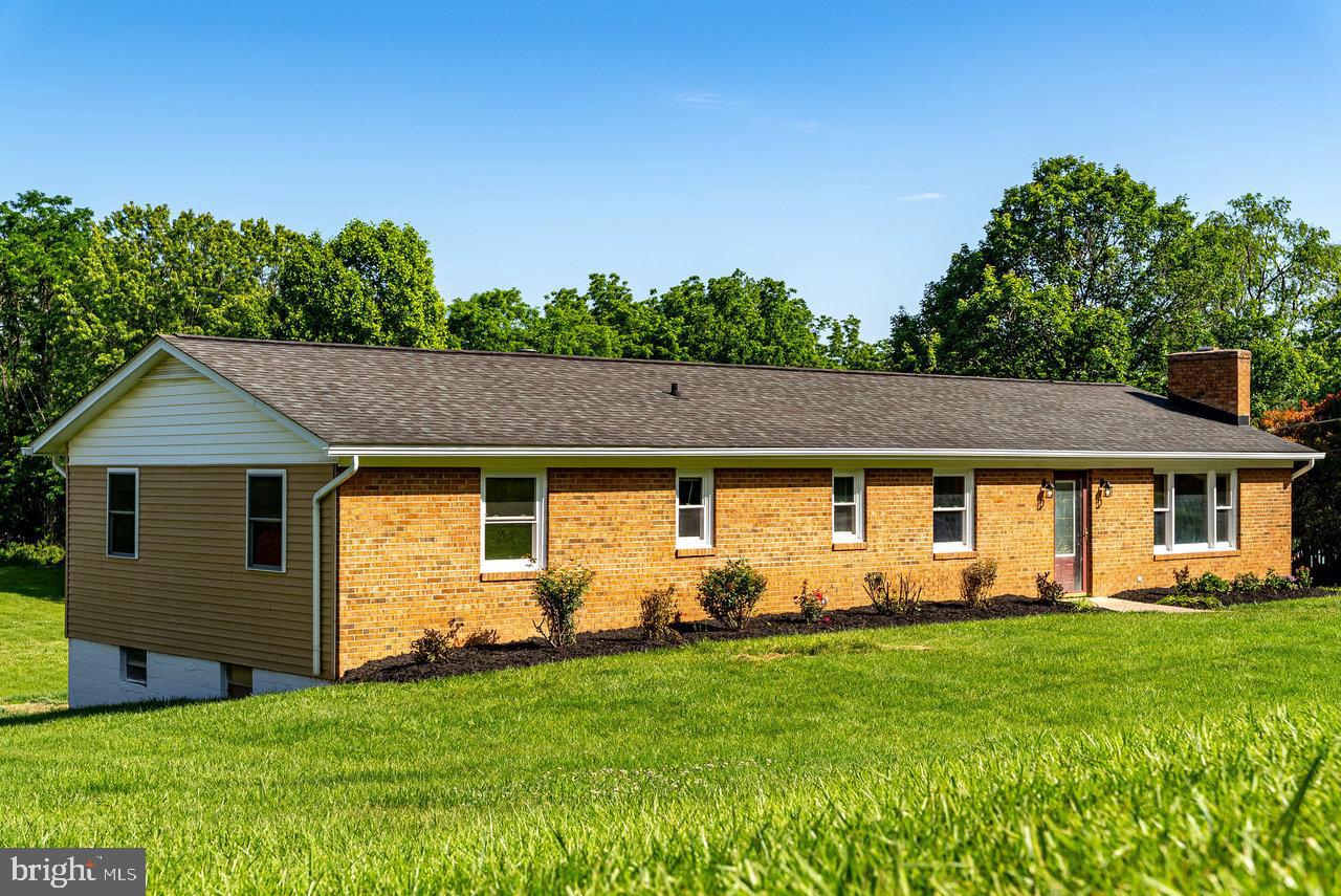 Are you searching for a home that’s move-in ready, beautifully updated, and perfectly positioned close to town — but not too close? This charming brick beauty offers the ideal blend of peace, convenience, and thoughtful upgrades.
With 1,584 sq. ft. of living space, this home welcomes you with gleaming, refinished hardwood floors and a stunning brick fireplace that anchors the cozy living room. The bright, updated kitchen features brand-new stainless steel appliances, crisp white cabinetry, and sleek granite countertops — ideal for weeknight meals or weekend get-togethers. A separate formal dining room provides the perfect setting for everyday dinners or special occasions.
Offering 4 spacious bedrooms and 2 fully updated bathrooms, there’s plenty of room for everyone to feel right at home. Need even more space? The full, unfinished walkout basement is a blank canvas, ready to become your dream recreation room, home gym, workshop, or extra storage space.
Set on a generous 0.43-acre lot, you’ll love enjoying peaceful mornings or relaxed evenings on the screened back porch. A newly paved driveway adds everyday convenience to this already perfect package.
Don’t miss your chance to make this move-in ready, beautifully updated home yours — schedule your showing today!
