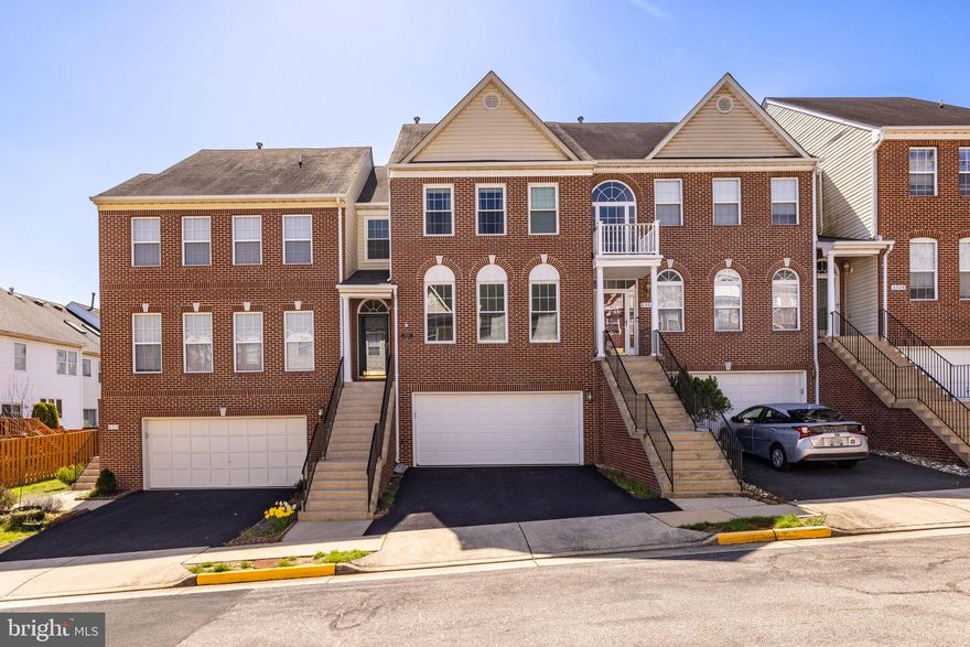 Welcome to 6305 Dunman Way, a stately brick-front Napier model  with an impressive list of upgrades tucked away in the North Village of Alexandria’s popular Kingstowne. This large 2-car garage townhome has an open floor plan, modern lighting, crown molding and dazzling hardwood floors on all three levels. It’s also been freshly painted throughout. The spacious eat-in kitchen spans the width of the home and has sleek granite counters, and a relaxation area with a corner gas fireplace. Step out and enjoy the Trex composite deck with its awesome SunSetter retractable awning -  perfect for upcoming summer gatherings. Steps descend to a classy brick patio and the fully-fenced and low-maintenance rear grounds. All the bedrooms have vaulted ceilings and both the hall and owner’s baths have been stylishly renovated. The lower level is actually ground level so the rec room is very light and bright - the ideal spot for a good movie or the big game!  There’s also a full bath and good storage. This fine property is in an enviable location close to Metro, two town centers and all commuter routes. It also comes with all the desirable amenities that owners love about Kingstowne living.