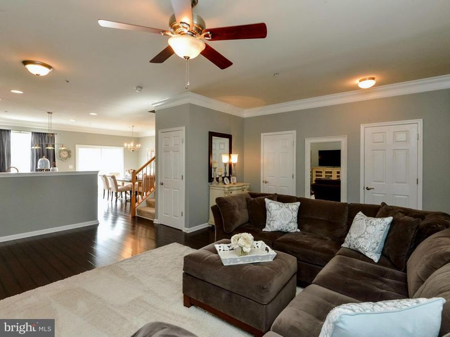 Move in ready- Come see this Beautiful 3 bedroom Townhouse which offers a large kitchen, center island, extra cabinets, gas stove. Beautiful bamboo hardwood floors and crown molding. Master bedroom offers soaking tub and large walk in closet. Basement is framed and offers much space. Nice landscaped front yard with a patio and fenced in back yard. Great community  with playgrounds & walking trails