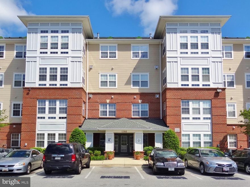 Newly Renovated Open Concept 2 BR/2 Full Bath Unit with FP in 55+ Cameron Grove Community!! Secure building in much sought after Cameron Grove Community of Upper Marlboro/Largo MD area.  Designed with wider hallways for ease of mobility.  Gorgeous Entry Foyer with Guest seating .  Resident Mailboxes are neatly tucked away along corridor leading to Elevator. Unit is  conveniently located next to Community Center, Indoor & Outdoor swimming pools, tennis courts, meeting rooms, library and a Social Lounge.   Jog/Walk paths weave throughout the neighborhood just in time to be taken advantage of in Spring!Step onto the tiled  Entry floor of Unit 206 and be greeted by an Open Floor planned space leading to a Large Great Rm complete with Gas Fireplace, new carpet, Dining accomodations and a Glorious attached Florida Room.   A built in niche and mantle above FP  will show off all your best and most cherished collectibles.  This freshly painted home boasts New tile floors in the Kitchen, Bathroom and Sunroom for easy cleaning, comfort and just the right splash of style,  Venture onward into the Fabulous Newly remodeled modern Kitchen replete with SS Dishwasher, Gas Range/Oven,  Fridge with Ice Maker,  gleaming White cabinets and scratch resistant Granite counters.   Make yourself comfortable  under Newly installed lighting while seated at the High Bar.  Neatly tucked away you'll also find a useful built in desk and full-sized Pantry.  Choose whichever bedroom you prefer and be guaranteed your privacy, with separation from their placement on either side of the Great Rm.   Directly off the Front entrance is a spacious bath with sink and vanity adorned with a Massive Full sized shower!  The New Front-Loading stackable Energy Efficient GE Washer & Dryer set and Linen closet complete this spectacular space with direct access to the Main bedroom .  Main bedroom is bathed in natural light, has recently painted Accent walls, newer carpet and includes a magnificent organized Walk-in-Closet.   The other Smartly designed Suite affords the lucky inhabitant all the upgrades of the Main bedroom along with the added Bonus of a Beautiful renovated bathroom!  This Contemporary styled oasis features Newness as far as the eye can see! Upgraded decorator style vanity, sink and faucet mix seamlessly with Goldenrod hued color scheme, and Wainscoting.  Soak your day away in the generous sized Tub you'll be thrilled to call your own.  Stop reading and schedule your Showing today before this one gets away!