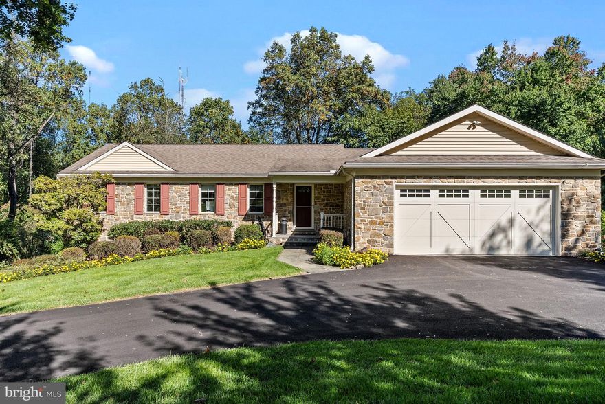 OPEN HOUSE SCHEDULED FOR 11/12 IS CANCELED.

 Introducing 449 Hidden River Road! A stunning stone-front, move-in ready, ranch style home nestled in a private and desirable Penn Valley neighborhood. This meticulously maintained home underwent a total renovation in 2009 and offers first floor living with a perfect combination of modern upgrades and timeless charm. This home features three bedrooms, with a potential fourth, three full bathrooms, oversized two car garage, and over 2,600 square feet of living space on just under an acre lot. Not included in the square footage is a massive flex space awaiting your personal touch. The endless amount of possibilities here makes this home a must see!

Step inside to a large entry way and you’ll be greeted with an abundance of charm from the crown molding and hardwood floors that flow seamlessly throughout the entire residence. The main living room features a vaulted ceiling and custom built in cabinetry with switch operated gas fireplace, creating a cozy ambiance for gatherings. Overlooking the living room is the gourmet eat-in kitchen with granite countertops, rollout cabinetry throughout, WOLF stovetop, and built-in paneled dishwasher and Sub-Zero Refrigerator. This space makes entertaining a breeze with it's easy access to indoor and outdoor dining spaces. The kitchen offers direct access to a lovely deck where you can enjoy the peaceful views of your wooded lot, and entertain for summer BBQs. A pocket door separates the kitchen from the formal dining room that features antique built ins and tray ceiling. Completing the right wing of the home is a pantry and interior access to the oversized two car garage with additional space for a workstation. 

The left wing of the main level consists of two bedrooms, two full bathrooms, and a laundry room with wash basin. The large primary suite, with tray ceilings, includes a walk-in closet and spacious bathroom offering a glass enclosed shower with bench seating and an oversized single vanity with plumbing capabilities for dual sinks.  An additional room on this level is currently being used as a sitting area, but would make a great office with the addition of French doors, or can be easily converted to a fourth bedroom.

The lower level makes this a truly unique and versatile home. When you reach the bottom of the steps you will be greeted by a family room showcasing a full brick wall that houses a wood burning fireplace, and plenty of natural light from the dual walkout doors leading to a covered patio. Continuing through the lower level you will find a bedroom, a full bathroom, and multiple closets allowing the potential for an in-law or au pair suite. An unfinished room, with plumbing, could be converted into a full kitchen making this space a true in- law suite. The lower level also provides access to the former oversized 2 car garage that has been insulated and is currently used as unfinished storage space. With exterior entry, the possibilities here are endless with an estimated 500+ square feet of flex space. Some ideas include an extended in-law suite, game room, future pool house, home gym, or even a space for your dream golf simulator! Finishing off the lower level is a walk in cedar closet and unfinished space that houses the upgraded utilities and provides plenty of storage. 

Notable upgrades include PEX plumbing throughout, whole-house generator (2021), new water heater (2023), roof replacement (approximately 2010), HVAC Updating (2021) and gutter guards with a transferable warranty (2021). A brand new driveway (2023), provides ample parking and curb appeal for this home set on a generous .92-acre lot.

Conveniently located in Penn Valley, this home offers easy access to prestigious schools, upscale shopping, and an array of dining options. With its prime location and exceptional features, 449 Hidden River Road presents a rare opportunity to own a truly remarkable residence.