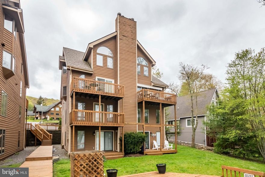 If you are looking for an incredible lakefront townhome in the heart of Deep Creek Lake, this is it! Offering three bedrooms, two baths and stunning lake views from most rooms. Wisp Ski Resort is also in your view, making for year-round beauty. The wood burning fireplace is one more great feature where you can enjoy those winter evenings. The lakefront deck is ideal to watch the 4th of July fireworks with family and friends. In warmer months, you can sit outside and grill at one of the many community grills and picnic area. Your community dock slip is very easy to get to, just around the side of the building. The location is within walking distance to many restaurants and activities, like Deep Creek Funzone with mini golf, bumper boats, lazer tag, go-karts, arcade and more. Call today to preview!