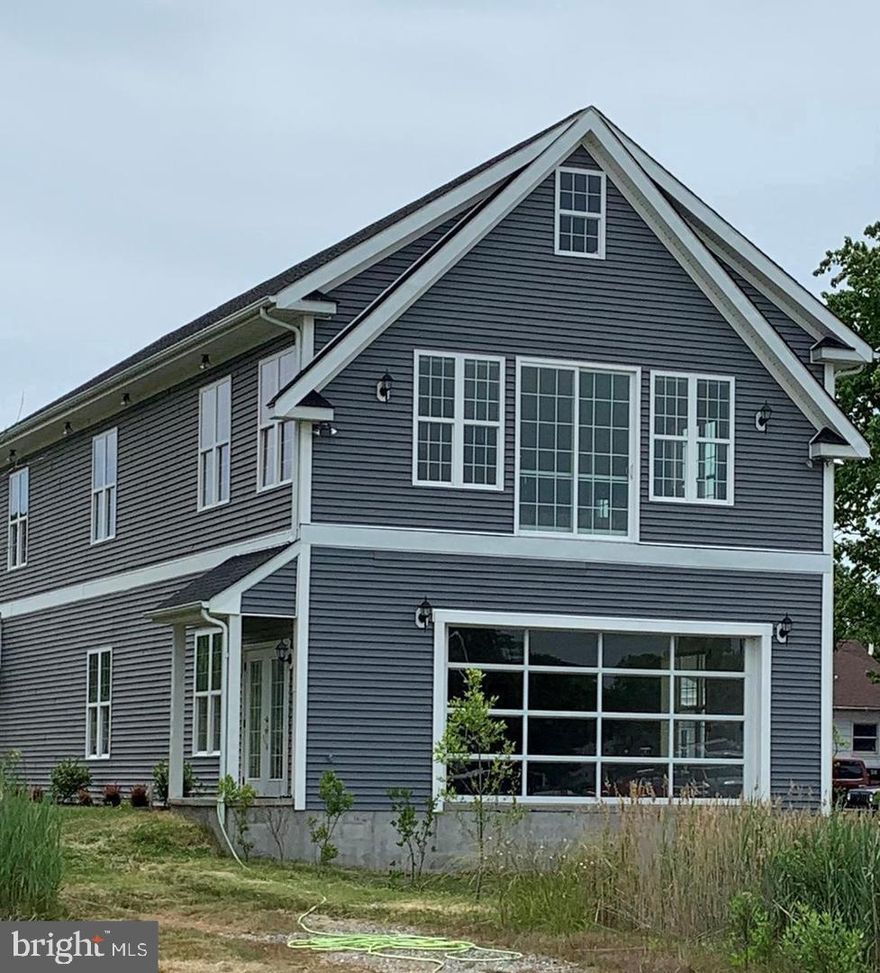 The opportunities abound for this waterfront home overlooking the Knapps Narrows.  Formally, Maynard Lowery's boat building business, this residentially zoned, single-family home comes with 5 boat slips and unlimited possibilities.  Can be easily expanded up to 6 bedrooms and 4 baths.  The first level would make an ideal hobby area or additional living area.  Handicap Accessible with elevator. Commercial potential.