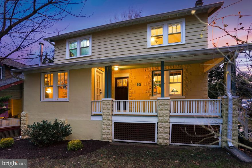 Welcome to 10 Jefferson Avenue, an exquisitely renovated Craftsman-style farmhouse overlooking Sligo Creek Park. Originally built in 1928, this stunning home has been thoughtfully restored and updated, blending vintage charm with modern conveniences. Every detail has been carefully considered, from the original wood trim and gleaming hardwood floors to the custom blinds, two-panel wood doors, and vintage fittings.
A quintessential covered front porch with a tongue-and-groove ceiling sets the tone for this inviting home. The handsome living room features a gas fireplace flanked by custom built-in bookcases adorned with sconce lighting. Beyond the living room, a cozy family room with glass French doors, a book nook, and a modern ceiling fan provides a comfortable retreat. A convenient mudroom connects both the porch and the family room. The elegant dining room, illuminated by a brass chandelier, flows seamlessly into the redesigned gourmet kitchen, creating an ideal space for entertaining. The chef’s kitchen boasts granite countertops, stainless steel appliances, handsome cabinetry with soft-close drawers, a gas range with a stainless-steel hood, a ceiling fan, and backyard access. A versatile office and updated bathroom complete the main level.
Upstairs, four spacious bedrooms and a full bathroom provide comfortable living quarters. The primary bedroom features wood flooring, a charming arched nook, and a modern ceiling fan. Three of the bedrooms have wood floors, while the fourth is carpeted with recessed lighting.
The lower level offers additional living space, including a recreation room with ample natural light, recessed lighting, and an exterior entrance. This level also includes a full bathroom, a guest room, and a large storage room with laundry and a workshop area.
The picturesque, fenced backyard features mature plantings, a deck, a shed, and rear surface parking. In the sylvan but still super-walkable heart of eclectic Takoma Park, this home offers the perfect balance of community and convenience. Enjoy easy access to trails, parks, playgrounds, shopping, restaurants, entertainment in both Takoma Park and vibrant downtown Silver Spring. Located on a quiet street facing Sligo Creek Park, the neighborhood is known for its summer block parties, holiday gatherings, and community meetups. Just over a mile walk or ride to the Red Line Metro, this home offers both charm and accessibility. You’ll love living here!