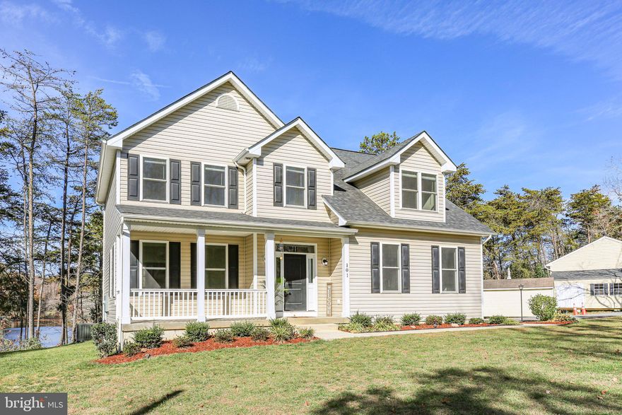 Discover your dream home in this stunning colonial-style property nestled on a picturesque .93-acre waterfront lot constructed in 2021. With three spacious bedrooms and modern amenities throughout, this home offers the perfect blend of comfort and elegance. 
Step inside to find beautiful vinyl plank flooring that flows seamlessly throughout the entire home. The heart of the home is the inviting kitchen, featuring maple cabinets, upgraded granite countertops, and a central island—ideal for both cooking and entertaining. The suite of stainless-steel appliances includes a built-in microwave, dishwasher, and electric oven/range, making meal prep a breeze. The open layout includes a cozy family room that flows off the kitchen, perfect for casual gatherings, while the formal dining room adds a touch of sophistication for special occasions. Relax in the luxurious master bath, complete with a soaking tub surrounded by tile and a separate tiled shower for added convenience. Enjoy year-round comfort with a gas fireplace in the family room, providing warmth and ambiance on cooler evenings. An upper floor laundry adds to the home's convenience, making chores a little easier. Step outside to your expansive outdoor space, where you can bask in the beauty of waterfront living. Whether you’re entertaining friends or enjoying quiet evenings by the water, this home offers endless possibilities. Not to mention the community beach offering lake access, pavilion, volleyball net and picnic tables all for residents use! Don't miss out on this incredible opportunity to own a piece of waterfront paradise—schedule your tour today!