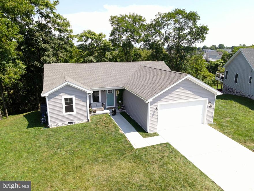 PRICE REDUCTION! This charming ranch-style home in the desirable Red Hill community offers a perfect blend of comfort and modern living. Built in 2020, this residence features an inviting open floor plan that seamlessly connects the kitchen and dining areas, ideal for gatherings and everyday living. The spacious kitchen is equipped with essential, stainless steel appliances, including a built-in microwave, dishwasher, and electric oven/range, making meal prep a delight. Enjoy the convenience of a main floor laundry area and an entry-level bedroom, perfect for guests or easy accessibility. With three bedrooms and two full bathrooms, this home provides ample space for relaxation. The primary bath offers a serene retreat, while the ceramic tile and hardwood flooring throughout add a touch of elegance. Natural light pours in through double-hung, low-E windows, enhancing the warm ambiance. Step outside to your expansive 0.35-acre lot, which backs onto open common areas and trees, providing a peaceful backdrop for outdoor activities. Located on a quiet cul-de-sac with no thru traffic, this home ensures a tranquil living experience. The attached garage and concrete driveway offer convenient parking options. The Red Hill community is known for its friendly atmosphere with a short drive to nearby parks, golf, and recreational facilities that make it perfect for outdoor enthusiasts. Local schools and public services are easily accessible, making this neighborhood a wonderful place to call home. Experience the comfort and community spirit that this lovely property has to offer! Purchaser may be eligible for an assumable loan at 2.99% through Loancare Mortgage. Ask your agent for details.