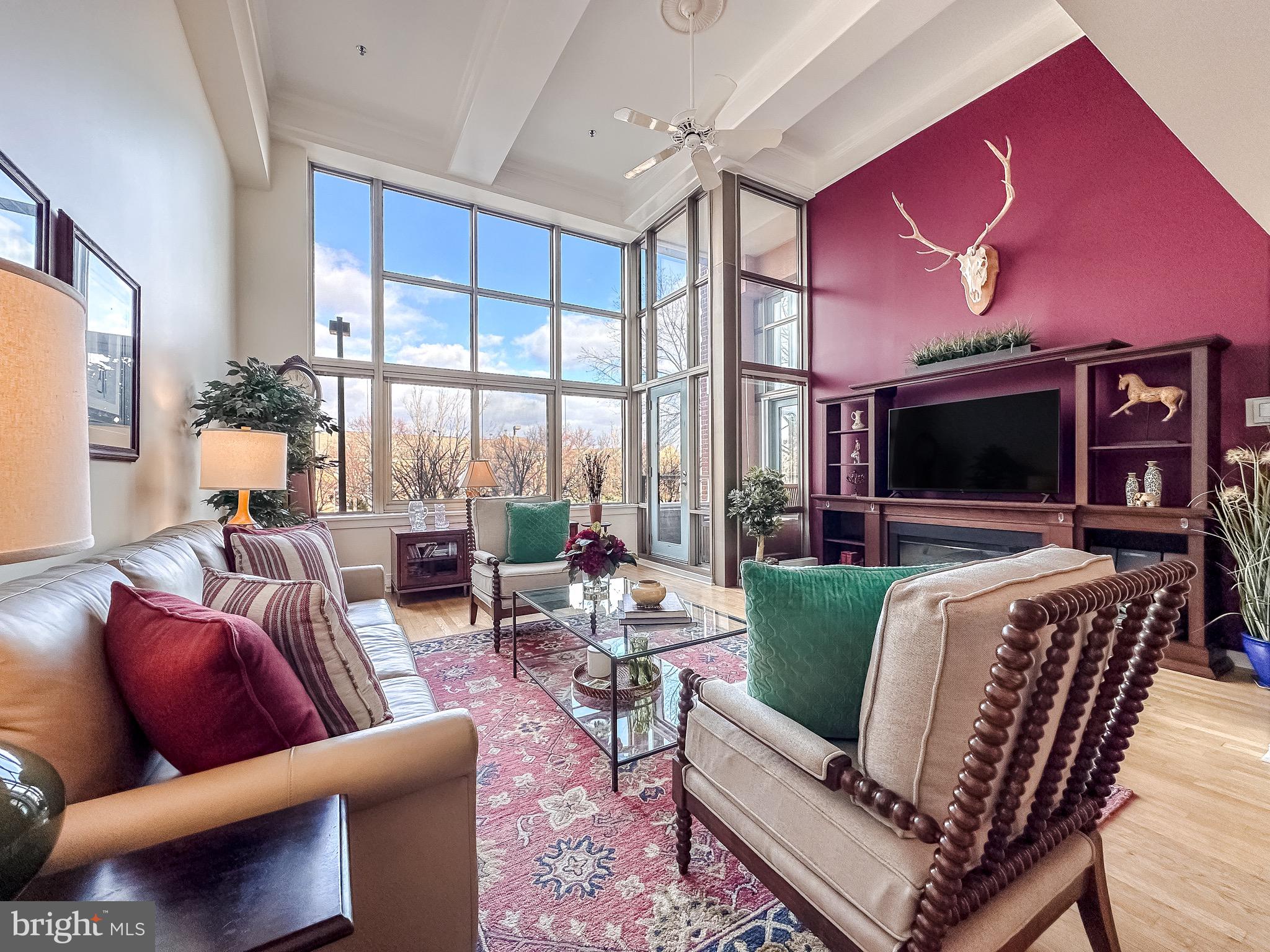 Discover unparalleled luxury in this one-of-a-kind 3-bedroom, 2.5-bathroom condo, the only unit in the entire building with its own private in-unit elevator. This stunning residence features hardwood floors throughout, expansive 17-foot floor-to-ceiling windows that flood the open-concept floor plan with natural light, and a sleek kitchen with stainless steel appliances. The renovated primary bathroom offers a spa-like escape, while two dedicated parking spaces add to your convenience. Building amenities include 24/7 front desk staff, secure parking, a board room, and a beautiful rooftop deck with breathtaking city and water views.