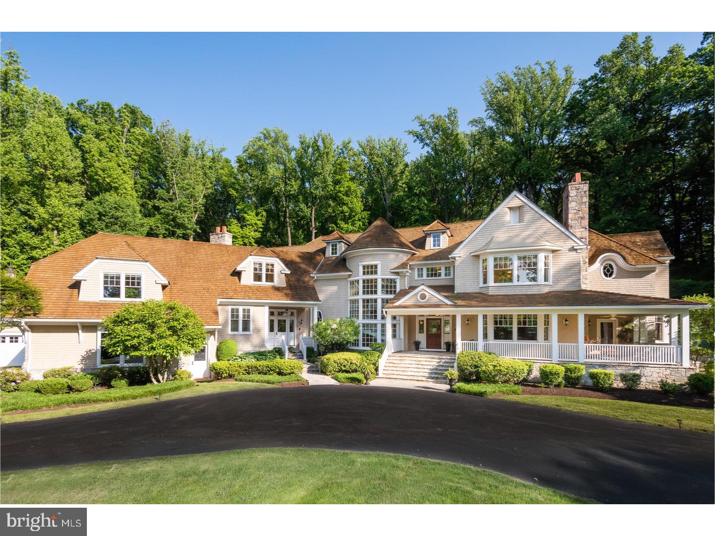 Thru the Gated Entryway & up the winding drive is a Beauty of a Home that has become one of the "Grand Dames" of Main Line Living, sitting on 16.5 magnificent acres. No expense was spared in the Planning, Design & Finish of this Exceptional Luxury home, which spanned a 3 year construction period & for which the cost basis far exceeds the Offering Price. Appreciate the genius of R.A. Hoffman, who laboriously designed this Beauty & carefully sited her to greet the Morning Sun and wish the setting Sun Adieu. This Architectural Wonder flows gracefully with Subtle Angles and Fine Lines. Look up to the Roof, Coiffed with Cedar Shake which continues to flow beyond the Roofline and drapes the side walls & Covered Porches. PA dry laid & stacked Stone exterior walls give a feeling of strength and stability. The Court Yard like area houses three separate two car garages (total of 6 garages) one being attached to the main house & one having a second level that can easily be finished as a Guest Quarters. Designed to look like she was born at the Turn of a Previous Century, she exudes Fun and Youthfulness, and a Confidence that this feel will continue once you enter the Main Door. Step into the Stunning Entrance Hall and you can feel this Lovely Home Embrace and Welcome you! A Sampling of just some incredible appointments: Gorgeous Wood Inlay Floors, a Rarely seen Floating Spiral Staircase spanning 3 Levels, a Blend of Old World Charm w/ Rumford Style Fireplaces & Trim to modern conveniences w/Elevator to all 3 Floors, Advanced Energy Efficiency w/ multi zoned HVAC and Electronic Technology ( annual Heating & Cooling savings) as well as Heated Floors throughout,Solid Interior Cherry Doors & varied Wood Species Trim-Wainscoting & Mantle Finishes. This Masterpiece is designed for Entertaining w/a Flowing & Open Floor plan w/Exterior Porches, Expansive Inground Gunite Pool & Cabana & Extensive Landscaping & Waterfall. On the casual side is the Custom Kitchen w/ Hand Made Cabinetry accented by Granite Countertops & Professional Series appliances. The Master suite will enchant you with it's formed accent Plaster Ceilings expertly designed & created by local craftsman, amazing Walk-in Closet w/gorgeous Custom Cabinetry & Opulent Master Bath. The Lower Level has been extensively finished & will amaze & delight w/ it's Home Theatre & so much more. Bring that Buyer who's looking for Comfort, Prestige & Value. Only a personal tour will convince you your home search is over.