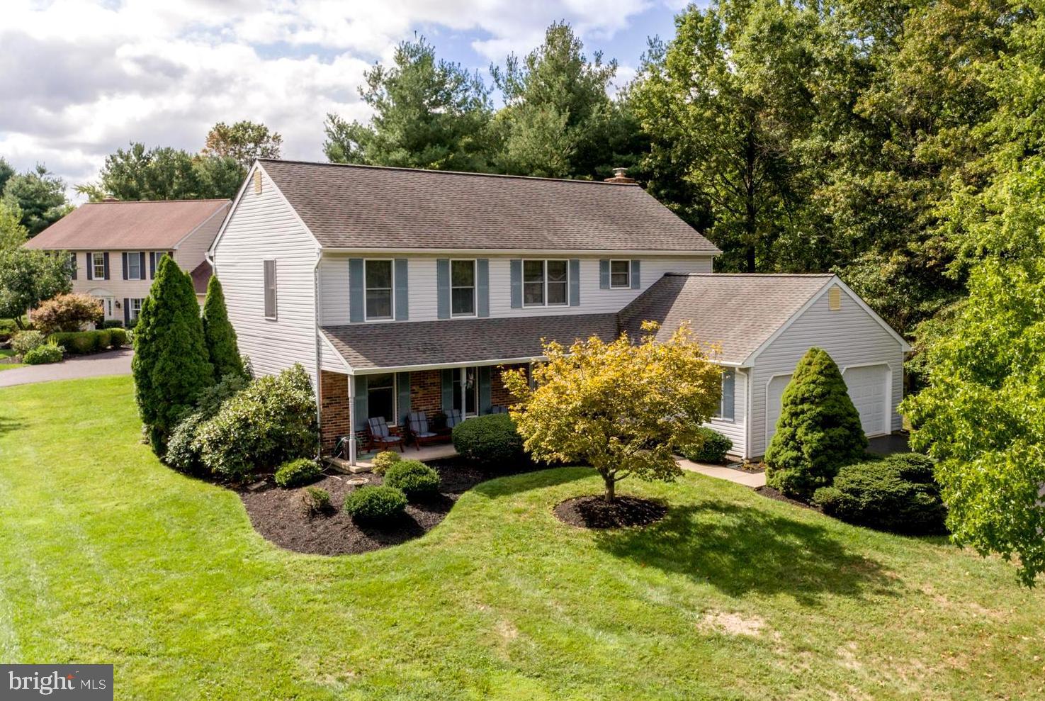 This is it!! A great 4 BR, 2-1/2 Bath, 2 Car Garage and beautifully finished Basement in an extremely desirable location! This Hatfield gem has many, many features that you don't want to miss. A beautiful entrance from a 28' roofed porch, a foyer with a hardwood floor, and 2 stage carpeted stairs with beautiful wooden handrails. The high foyer has a brass chandelier. Then there's a hallway that leads to the 1st-floor laundry, security system controls, the 1st-floor powder room, and a door to the 2-car oversized garage with a side door to a 12' x 8' concrete pad, and pull-down stairs for storage. This home has both a formal living room AND an oversized 22 ' family room with 2 skylights, a French door to the 21' 6" x 13' patio, and a brick, wood-burning fireplace with 2 brass accent lights above. On your way into the kitchen, there's a separate dining area with 2 skylights and a tile floor for breakfast and quick meals. Then there's a full country kitchen with tile floors, granite countertops, recessed lighting, stainless steel sink, oak cabinets, garbage disposal, a nearly new microwave, refrigerator, dishwasher, and an area with a desk. Then, into the formal dining room with carpet, a brass chandelier, and crown molding. Continue into the carpeted living room to complete the first-floor walkthrough. On the 2nd floor, there's another spacious foyer with double windows and access to the brass chandelier. The master bedroom has carpet, a very large walk-in closet, a tile floor, a master bathroom with double sinks, a walk-in shower, and a full relaxing Jacuzzi corner tub. There are 3 more good-sized bedrooms with carpet and double doors for the closets. The stairs leading down to the finished basement has wood paneling and carpet,  The finished basement has a beautiful L-shaped bar and socializing area. Then there's a second finished room to be used for exercise or whatever hobby suits you! There's also an efficient office. The Heater, water heater, central air, and sump pump are all in good working order. The lot to one side of this home is township owned and has some really nice trees for privacy. This home is perfect with an elementary school just 2 blocks away.  Hatfield is a wonderful place to live. It is a short distance in 3 different directions to numerous shopping and dining areas. And yet, is still a very quiet neighborhood. Easy access to routes 309, 113, and 63. This home is in great shape, with a great location and privacy. This is a Must See!! Owners May be Home, handicapped.