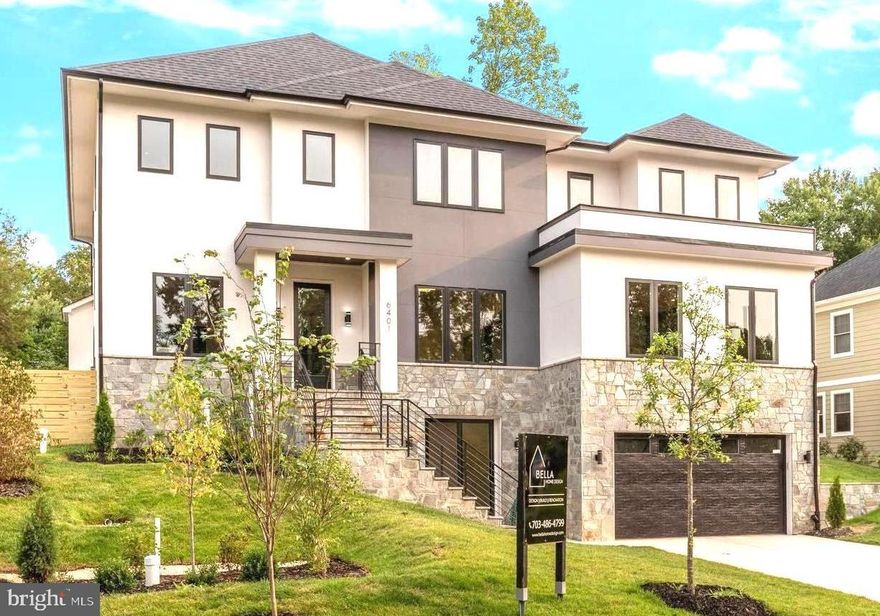 ***  OPEN SATURDAY AND SUNDAY,  MAY 18TH AND MAY 19TH, FROM 2.00 TO  4.00 PM.
 
 LUXURY UPGRADES HAVE BEEN ADDED TO OUR NEW HOME!   ELEVATOR TO  ALL 3  LEVELS,   LOWER LEVEL MINI KITCHEN, OUTDOOR  KITCHEN,  MAIN  LEVEL OFFICE WITH FRENCH DOORS, LOWER LEVEL  EXERCISE ROOM/OFFICE AND DIMMERS INTEGRATED THROUGHOUT THE HOUSE.  ***

Exquisite magnificent living is redefined in this spectacular sleek modern design home from Bella Home Design. 7200 square feet.  Meticulously built with luxury living spaces, superb quality and well-executed finishes. This gorgeous home has an open floor concept and boasts 6 bedrooms , 6 full bathrooms and 2 half baths. 7 1/2” European oak floors throughout all 3 levels.  Beautiful wood accent walls throughout the home.  10 ft ceilings on the main floor and 9 ft on the upper and lower levels.

As you step into the main floor foyer, you will be greeted by the beautiful open space dining room, a formal office with french doors, an expansive family room and a large main level bedroom guest ensuite . The impressive kitchen is adorned with a massive 10 ft island with quartz countertops and showcases top-of-the-line Jenn-Aire stainless steel appliances, a built-in pantry room and a butler’s pantry. The backyard open air is equally enticing with an outdoor kitchen for BBQ and entertaining,  walls of glass sliding doors and windows with natural sunlight granting access to a covered porch and patio off the kitchen all within a fully fenced yard.

Ascending to the upper level, you will discover 4 bedrooms and its own private 4 bathrooms, and a large laundry area with full cabinetry. The grand owner suite boasts a separate sitting room with an electric fireplace, a spa-like bath with heated floors, a spectacular 2-person rain shower, a free standing oversized 72” soaking tub, and a 2 huge walk-in closet with custom cabinetry.

The lower level features a 4 tandem car oversized garage, a custom built mud area, a gas fireplace in a spacious family room, mini kitchen, exercise room, bedroom, full bathroom and half bathroom.  Great  setting for an extended family member or au pair.

This private retreat offers an effortless commute to Washington, D.C., McLean, Arlington, Falls Church, Tysons, and Dulles—a commuter's paradise! Close to McLean silver line metro and West Falls church orange line metro. Conveniently located inside the beltway to I-495, I-66, GW Parkway, Route 7, 123, and Dulles Toll Road, with quick access/commute to Tysons Corner,  Restaurants, Movies, Amazon HQ2 and Washington DC.