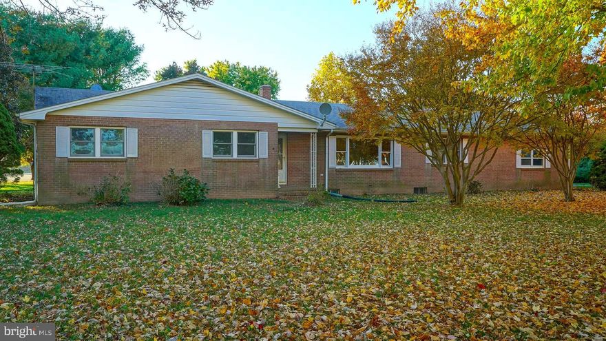 HUGE Price Reduction! All Brick 4 Bedroom, 2 Bathroom Ranch Style home on 1.66 unrestricted acres in the most beautiful country setting.  At approx. 2100 sq ft, this property features spacious rooms, wood flooring, a full, unfinished basement (estimated  2000+ sq. ft of unfinished living space) and a large 2-car garage.  This house has great bones and with some  TLC and vision would make a beautiful home. Right next to 110 acre Roundtop Park which has a playground, pavilion, basketball court and multiple athletic fields. Schedule your showing today!