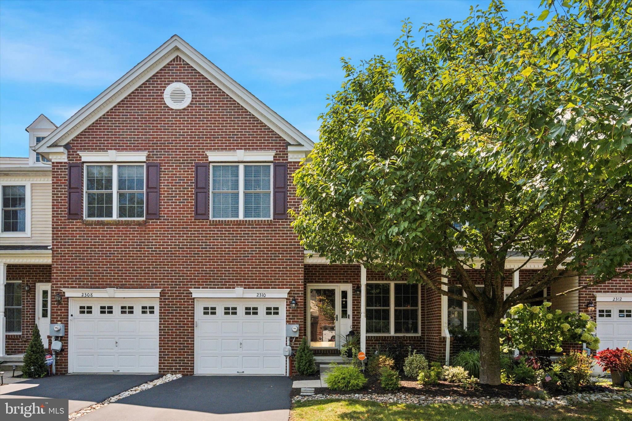 Located in Arbor Point of Buckingham Township, this townhome has been meticulously maintained and beautifully updated in recent years. As one of very few 4-bedroom 2.5-bathroom town homes in Arbor Point, this home offers nearly 2,200 SF of living space on the two main living levels and a maintenance free lifestyle in a neighborhood full of amenities! Built by Toll Brothers in 2008, Arbor Point offers its residents the luxury of a clubhouse with a fitness center, community pool, and a playground. Brick front façades give the neighborhood a classic charm, and the covered front entry is welcoming. Upon entering the home, you can’t help but notice the beautiful hardwood flooring that runs throughout the entire first floor, as well as the open concept living space providing a line of site all the way to the back of the home. From the foyer, the living room and dining room create a more formal living space, perfect for entertaining family or friends on any occasion. The back half of the main living level is where you will find the heart of the home, the eat-in kitchen and family room. Updated in 2024, the kitchen is well-appointed and nothing short of functional, featuring grey shaker cabinets with crown molding, stainless appliances, subway tile style backsplash, quartz countertops, a gourmet design layout and an island with seating for three. The family room is spacious and open to the kitchen, highlighted by a new gas fireplace (2023) with stone surround, decorative mantle, and oversized windows on either side. From the kitchen, you can enjoy a private outdoor space backing up to the outer edge of the community. Rounding off the main living level is a half bath. Heading upstairs there are 4 bedrooms, 2 full bathrooms, and a laundry room. The master bedroom is spacious with a coffered ceiling, three windows, two closets, and a full bathroom with double sinks, soaking tub, and a glass surround stall shower. Bedrooms 2, 3, and 4 are similar in size, have adequate closet space, and share the hall bathroom. Going downstairs, the basement is finished, providing approximately 500 SF of additional living space, and additional storage. Other features of this home include, but aren’t limited to, public sewer/water, natural gas heat and cooking, and a 1-car garage, all in the Central Bucks School District! Arbor Point is just minutes from Doylestown Boro, all your shopping needs, great restaurants, and allows for easy access in and out of the area via 611, 263, 202, and 313.