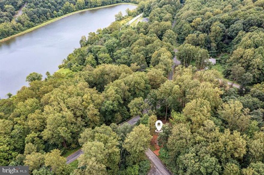 Build Your Dream Home in the Mountains! You've waited long enough...
Tucked away in the peaceful Carroll Valley, is Fairfield’s countryside. This lovely homesite at 28 Swallow Trail Fairfield, PA offers the perfect opportunity to create the home you’ve always imagined.  .73 acre corner lot perc-approved with septic design, driveway permit, and initial clearing complete.  There are no Builder restrictions, or HOA restrictions; this site is ready for a 3 Bedroom home of your choice.  It’s just a short walk from Lake Mae with fishing, kayaking, and hiking. The beautifully wooded site is surrounded by mature trees, fresh mountain air, and the quiet charm of nature;  it delivers the rare combination of privacy, nature and convenience.
Whether you envision a cozy cabin retreat, a full-time residence, or a weekend getaway, this lot provides a serene backdrop with plenty of space to design exactly what you want. Enjoy morning coffee with birdsong, star-filled nights, and the relaxed pace of Carroll Valley living.
Located just minutes from local shops and dining, it is just a stone’s throw to Liberty Mountain Resort, Carroll Valley championship Golf Course, the rolling hills of South Central Pennsylvania, and the foothills of the Appalachian Mountains. You’ll love the easy access to Gettysburg, Waynesboro, Frederick and other Maryland and PA venues — while still feeling worlds away from the hustle.
Bring your vision! You’ve waited long enough…