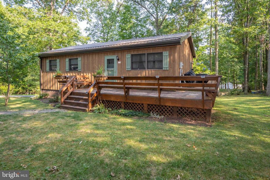 Welcome to this meticulously kept home located within the city limits of Mountain Lake Park, just a short drive to Oakland, local schools, and the beautiful Broadford Park. This charming property boasts 3 bedrooms and 2 baths, with the lower level bedroom currently serving as a stylish bar room. With its own window and closet, this room can be effortlessly converted back into a bedroom to suit your needs.

Enjoy the convenience of public utilities and the luxury of a fully-finished basement, which has recently undergone a complete remodel. Every detail of this home has been carefully maintained, making it move-in ready. Don't miss the opportunity to make this delightful residence your own!