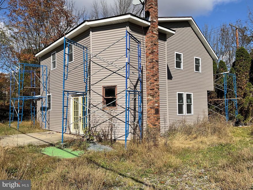 Endless Potential on a Full Acre in Lehighton!

Bring your vision to this classic farmhouse set on a spacious 1-acre lot—perfect for investors, flippers, or handy homeowners looking to create their dream home. Much of the heavy lifting has already been done, with framing and electrical work mostly completed and brand-new siding and windows already installed.  All finishing materials in the home are included: drywall sheets, siding, tub surrounds, and cabinets.

Offering the potential for 4 bedrooms and 2-3 baths, this home is a blank slate ready for your finishing touches. The large lot provides plenty of room for outdoor fun, gardening, or future expansion.

Enjoy the best of both worlds with a peaceful country setting that's still close to town and offers easy access for commuting to the Lehigh Valley and beyond.

Don't miss this opportunity to transform a timeless farmhouse into a stunning modern retreat—so much potential awaits at 265 Mill Road!  Sold as-is.
