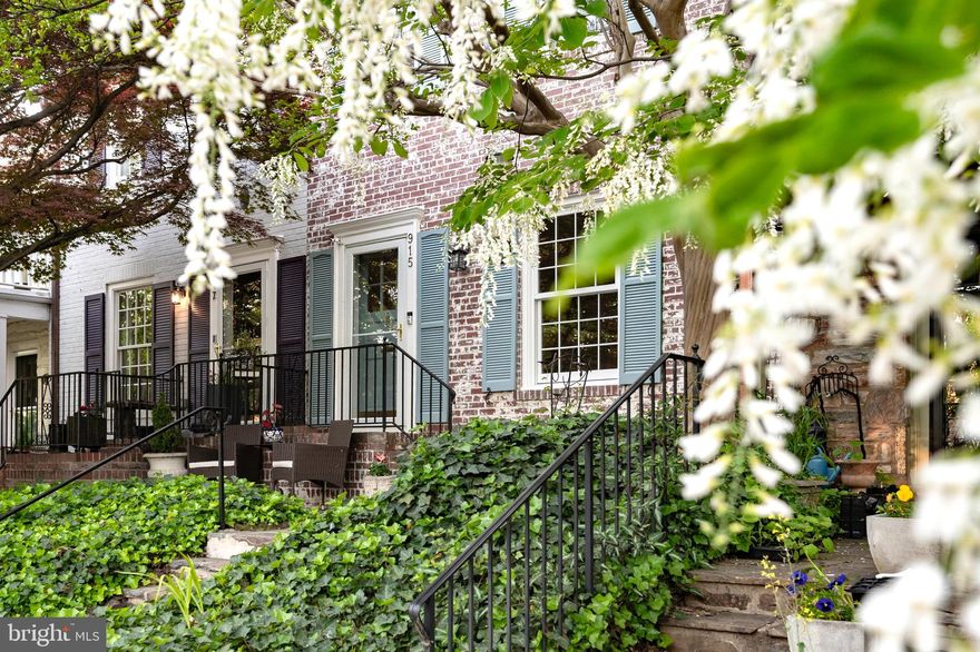 Yates Gardens homes in SE Old Town are known for their charm and this 3BR/3BA home does not disappoint.  Up the front flagstone steps and path (with a small, adjacent patio for seating), the brick exterior has a whitewashed look and a brick front stoop shared with the house next door. Enter through a gracious living room with gas fireplace, open to the dining room with two large storage closets/pantries beyond. The kitchen is off the dining room and was fully renovated in 2022 with cabinets in a cerulean blue hue, and striking, floor-to-ceiling tile that gives the feel of an Italian villa. **** When the owners put on an addition at the back of the house in 2021/2022, they designed it to serve as a family room that could easily transition to a bedroom, should they eventually wish to live on one level – a feature difficult to find in an Old Town row home. A stylish full bath with stall shower (glass door) is situated off the bright room. Naturally, the layout offers alternate lifestyle options. If you want a guest room, but don’t want to dedicate space for that purpose, set it up as a Family Room with sleeper sofa or murphy bed to convert it to an ensuite guest bedroom when friends visit. Or if you simply want to enjoy the afternoon sun in a family room or office, with the convenience of a full bath for easy use after coming in from the great outdoors, this space is for you.  You can exit the family/guest room to the charming, fenced brick patio and onward through the gate to the to the public alley behind the house – convenient, for example, so you don’t have to carry a bike or other gear through the house. **** On the lower level is a rec room with abundant closet space, a utility/laundry room with still more storage, and a stylish full bath fully updated in 2023. ****  The generous primary bedroom on the upper level has a wood burning fireplace.  Another spacious bedroom shares the hall bath that was refreshed in 2024 with in-wall medicine cabinets.  Windows of the original house were replaced in 2023; and the slate (front)/shingle (top rear) roof replaced in 2022. Windows and roof of the family room/guest bedroom date from the addition in 2022. There is one private parking spot in the service road in front of the house. (Lot extends into the service road; City of Alexandria attorney letter available to explain parking situation on the block) **** The 900 block of S. Saint Asaph St is a dead-end block: a destination not a thoroughfare, with a refreshingly friendly neighborhood vibe.  Easy access to the bike path toward Mount Vernon or Jones Point Park, and about 2/3 mile stroll to King Street. There’s a bus stop close by to get you to the metro, and easy access to 495 or the GW parkway to head out of town or into DC. Please ask to see the full list of updates and improvements.  Check back for photos on May 1st!!