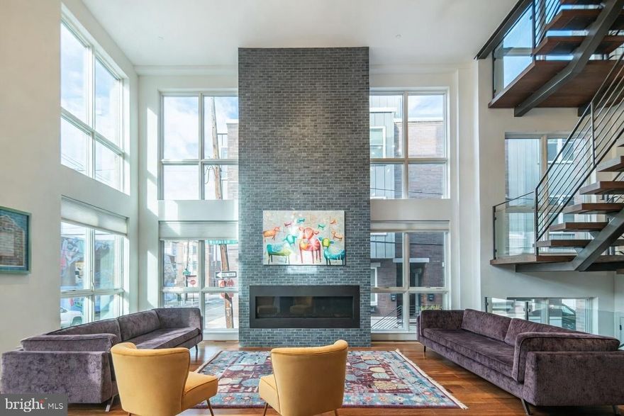 An Unrivaled Urban Masterpiece - This residence defies every expectation of City living. Spanning an extraordinary 60 ft (3 lots) and rising five levels, this 8,160 sqft modern icon is wrapped in floor to ceiling windows, soaring ceilings, and features six outdoor spaces (an additional 2,400 sqft exterior living space) with views from the Schuylkill River to the Center City skyline and beyond.

Main Level - An open expanse with heated-tile foyer and 22' ceilings. Brazilian Chestnut hardwood floors glow beneath a wall of glass, framing a majestic living room anchored by a large fireplace. The chef’s kitchen features a 15 ft quartzite island, Sub-Zero refrigerator, built-in Miele cappuccino station, six refrigerated drawers, and Pitt cooktop floating six-burner range built into the natural stone countertop. Exit the glass doors to your private terrace with built-in Wolf grill — perfect for dining al fresco. A discreet coat closet and powder room complete this flawless first level.

Second Level – An Intimate Retreat Awaits. Ascend to three serene bedrooms, each with en-suite full bath. A cozy reading nook opens to the second exterior living space — ideal for morning coffee. A full laundry suite keeps life effortless.

Third Level – The Primary Wing. The primary suite is pure indulgence: a crackling fireplace, private balcony, and spa bath with rain showers and sculptured freestanding tub, heated floors, bidet, and double vanities. Indulge in the expansive walk-in closet and dressing room. A separate guest bedroom with en-suite bath on this level ensures privacy for all.

Fourth Level – The Ultimate Entertainment Realm. The City is your backdrop with dramatic floor to ceiling windows surrounding a second entertaining kitchen with 10 ft natural stone island, Sub-Zero refrigerator, dual-zone wine cooler, and dishwasher. Two sprawling decks, a bubbling hot tub, built-in Wolf grill, and convenient half bath let you host a party or an intimate retreat — every inch is designed for unforgettable nights under the stars.

Rooftop Terrace - The crown jewel: a 360-degree 1,000+ sqft rooftop terrace floating above Philadelphia. Center City’s towers sparkle to the east, the Schuylkill glimmers below, and University City glows across the river. Sunrise yoga or midnight cocktails — this is your private sky lounge.

Finished Lower Level –  A rare daylight-drenched basement with radiant heat floors and full bath provide endless possibilities. Transform it into a golf simulator, screening room, gym, playroom, or sixth bedroom — the choice is yours.  2 car garage parking located directly off the lower level.

Additional Luxuries:
Eurofase lighting
4 Zones, 4 HVACs
Pella Architect Windows
Side by side two-car garage
Elevator stops on all five floors
Full 10-Year Tax Abatement began in 2023
Immediate Delivery

This is not just a home. This is one of Philadelphia’s largest and widest townhome— an urban oasis where scale, craft, and spectacle converge. Once you step inside, everywhere else will feel ordinary.  Schedule your private viewing of one of the city’s finest residence. Opportunities like this appear once in a generation.

LOCATION
10 min walk, 5 min drive → Schuylkill River Trail
12 min walk, 5 min drive → Rittenhouse Square
15 min walk, 7 min drive → CHOP, Penn, 30th St Station
15-25 min drive → Philadelphia International Airport
Walk Score® 98 | Bike Score® 92

Property owner is a licensed real estate agent.