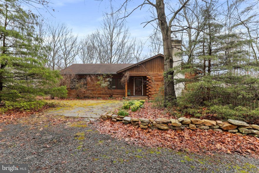 Don't miss your opportunity to own this charming log cabin nestled on 30 acres! Fully wooded parcel provides privacy and seclusion, along with a wet weather creek. Featuring 3 bedrooms, 2 full baths. Boasting over 3,000 sq.ft. of living space. Offers an open floor plan. Living room with a pellet stove insert fireplace. Eat-in kitchen with propane gas cooking. Primary bedroom with direct access to the deck, and en suite with double sinks, soaking tub, and separate shower. Office/den. Main level laundry. Spiral staircase that leads down to the partially finished basement. Spacious recreation room with a freestanding wood stove. Walkout level to backyard. Enjoy your days on the wraparound deck taking in the tranquility and natural beauty of the outdoors. Make this your year-round or weekend getaway oasis! Schedule your tour today!