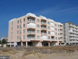 Direct oceanfront 3 bedroom, 2 bath unit in a great midtown location! Oceanfront master features motorized storm shutters over large OF window, & has direct access to balcony (which also has storm shutters). Sprinkler system, hand painted murals, spacious laundry room, amazing ocean views. Four story building is situated approx. 30 feet forward of neighboring buildings and has a wonderful private feel, with secure lobby & elevator, 2 assigned parking spaces (1 covered), outdoor pool & shower as well as convenient storage locker.