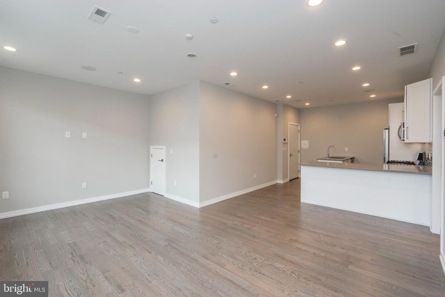 Welcome to 1128 S. 13th Street, Unit 2F! This apartment is the epitome of elegance and style. The main floor has hardwood flooring throughout, and features a bright and sunny living room; a gourmet kitchen with white cabinetry, quartz countertops, stainless steel appliances, and a custom tile backsplash; a large bedroom with walk-in closet; convenient laundry area; and a stunning full bath with custom glass-enclosed walk-in shower. This home features in-ceiling speakers, a video intercom system, and Nest thermostats, and has access to a shared roofdeck with stunning views of Center City. Located in the heart of Hawthorne, there are shops and restaurants just steps away, and public transportation one block over. Don't wait, schedule your showing of 1128 S. 13th Street, Unit 2F today!