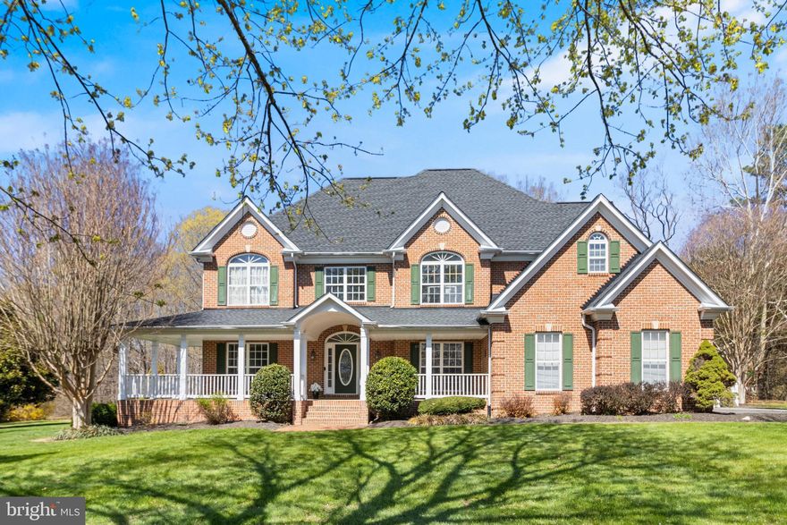Stunning La Plata brick‑front Colonial located in sought after Hillendale Subdivision sits gracefully at the end of a quiet cul‑de‑sac, offering the kind of space, comfort, and privacy that makes a house truly feel like home. Nestled on a beautifully landscaped 1‑acre lot, this 5‑bedroom, 5‑bath residence blends classic charm with thoughtful updates and an easy, natural flow. Step inside to generous living spaces with generous sized bedrooms, sunlit rooms, and a fully finished walk‑out basement perfect for gatherings, hobbies, or extended‑stay guests. All upper-level bedrooms have their own bathroom. Beautiful Two -story foyer with natural light shining through the tall living room windows from ceiling to the floor. Spacious master bedroom with balcony overlooking the back yard. Finished basement offers bedroom, full bath, plumbing rough in for 2nd kitchen which would make the perfect in - law suite or apartment. Basement also has a bonus room which is currently being used a gym and a generous size storage room. Outside, the manicured lawn, paver patio, and fully fenced yard create a peaceful retreat for morning coffee, weekend barbecues, or simply unwinding at the end of the day. Enjoy your morning coffee on the wrap around cozy front porch and summer evenings on the backyard paver patio.  And with no HOA, you’ll enjoy the freedom to make the space your own. Located in the heart of La Plata, you’re just minutes from everyday conveniences—local restaurants, bakeries, boutiques, and multiple grocery options—while still having quick commuter access to 495/95/50/210 and nearby military bases including Indian Head, Joint Andrews, Patuxent River, and Fort Belvoir. When it’s time to relax, you’ll love being close to Chapel Point State Park for boating, kayaking, hiking, and sandy shoreline fun, as well as Bensville and Gilbert Run Park for even more outdoor adventures