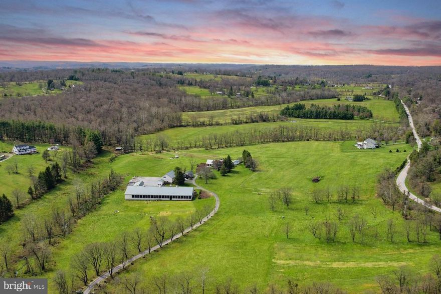 ESSENCE
Live authentically. Belfast Manor, Circa 1818. Timeless stone estate set within the rolling pastures of Sparks within the glorious Western Run Valley, spanning over two parcels for a total of 57.504 acres. Relish the sense of arrival with treeline drive that is lush in the spring and ablaze in the fall. Authentic architectural details intact. Exposed beams punctuate this classic homestead. A luminous glass sunroom extends the seasons. Create a delicious custom pie in your pizza oven in the kitchen. Splash in the shimmering saltwater pool as days melt into evening light. Retreat or gather on a multitude of outdoor spaces with framed views. Experience what it is like to live in a landscape painting. Finished lower level optimized for play and movie night. Expansive covered arena with a stone fireplace and concrete floor. An open air party barn like you've never experienced, ripe with potential. Outbuildings include a storied bank barn with two apartments, a spring house, grainery, two run-in sheds and a four car detached garage. State of the art mudroom, loft over attached two car garage. Embrace the country lifestyle. Enjoy cutting fresh flowers from your peonies garden. Xfinity internet. The art of uniting human and home. Cultivate your existence.

LOCAL FLAVOR AND PROVISIONS
John Brown Store and Wegmans. Favorite local dining atThe Milton Inn, The Oregon Grill, The Butler Cabin, and The Filling Station. An exit north offers Graul's Market along with Casa Mia’s, Manor Tavern, The Fill'Er-Up, The Yellow Barn, Woodfire Kitchen and The Creamery Connection. Tap into local breweries, such as Inverness Brewing, Farmacy Brewing and Big Truck Farm Brewery.

OUTINGS AND LEISURES
Explore the NCR Trail. A 21-mile flat, crushed-stone trail open to hikers, bikers, and horses, it runs along the scenic Gunpowder Falls river. Minutes to Prettyboy Reservoir. This area is open to hiking, rowing, or paddle boating, bird watching, horseback riding and nature photography year-round, and for archery hunting during a regulated season. Go tubing on the Gunpowder River. Enjoy Ladew Topiary Gardens... these gardens are 22 acres of spectacular, award-winning gardens, more than 100 remarkable topiaries, a mile-long Nature Walk, and native Butterfly House. Explore The Manor Mill, a pre-revolutionary grist mill that now houses a wide variety of art and entertainment events. Tee off at Greystone Golf Course in White Hall. Or visit The National Lacrosse Hall of Fame and Museum which honors the history and legends in the sport. 

PROXIMITY
Zippy access to the I-83 on ramp, about 8 minutes to Hunt Valley, and about 18 minutes to Towson. 45 minutes to BWI and 23 minutes to Penn Station.

REGION
Sparks Glencoe is known for its scenic rural landscape, and historic charm. The original 1916 Sparks State Bank now serves as a Nature Center.
