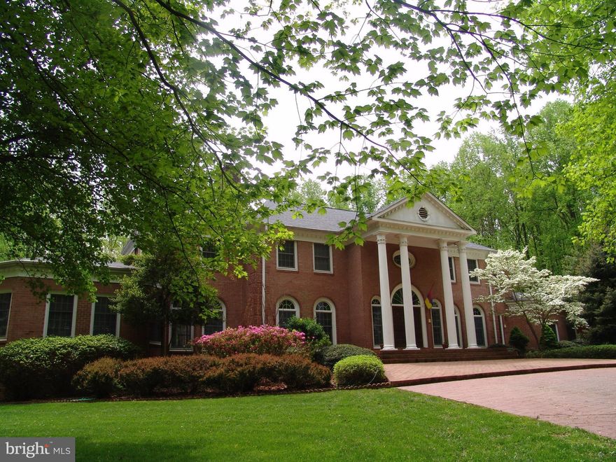 Magnificent 5 Bedroom, 8 Bathroom Colonial. Nearly 1000 SF finished space means an abundance of room for hobbies & other interest plus elegant rooms for entertaining. Amenities include an electric metal gate, 34 ft. mirrored exercise room with steam shower, 2 sided deck with connecting barrel ceiling bridge.