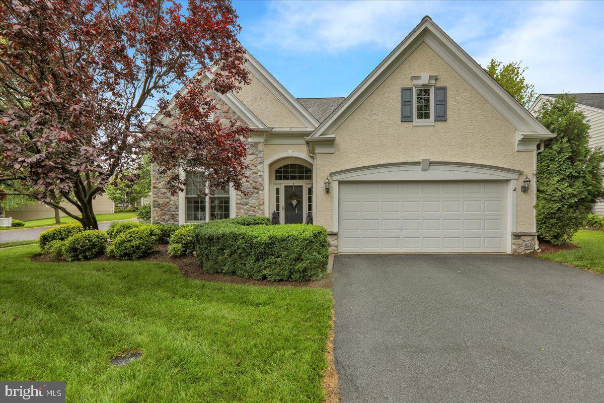Welcome to 213 Aster Circle, a beautifully maintained single-owner home nestled in the heart of Traditions at Longwood, one of Kennett Square’s most desirable 55+ communities. This thoughtfully designed Kennett model offers two spacious bedrooms and two full bathrooms, including a well-appointed primary suite with a walk-in shower, corner Jacuzzi tub, double vanity, and an expansive walk-in closet.
From the moment you step inside, you'll notice the refined architectural details that elevate the home’s character. The open layout is enhanced by elegant columns and lofty ceilings, creating a light and airy atmosphere. The formal dining room is a true centerpiece, showcasing a spectacular gold-leaf barrel ceiling that adds a touch of drama and distinction to the space.
The kitchen is equipped for both daily ease and entertaining, with gas cooking, a double sink, dishwasher, and a pantry for extra storage. It flows effortlessly into the breakfast area and family room, where a gas fireplace and built-in TV cabinet with shelving make the space both functional and inviting.
Step outside onto the paver patio, surrounded by mature landscaping that offers privacy and a peaceful retreat. A power awning, installed about five years ago, adds shade on warm afternoons.
This home has been impeccably cared for, featuring a new A/C condenser installed in 2025, a roof replaced in 2022, and a Generac whole-house generator for peace of mind. There's also a walk-up storage area over the two-car garage, perfect for seasonal items or additional organization. An irrigation system keeps the lawn looking its best year-round.
Located in a community filled with a clubhouse, tennis courts, and friendly neighbors, 213 Aster Circle offers more than just a house—it’s a lifestyle.
Come see what makes this home and community truly special.
