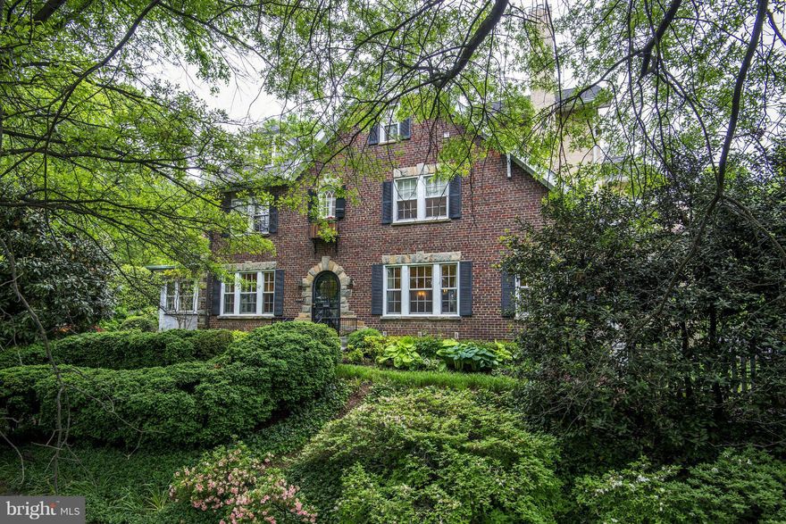 A study in tranquility: Bright and airy and beautifully decorated with high ceilings + plentiful windows. Lg living room w/fireplace opens to sunroom; family room and kitchen/breakfast room open to stone terrace and lg level garden. Master suite with private balcony, spacious closet and bath; 4 additional bedrooms up + study with terrific built-ins.