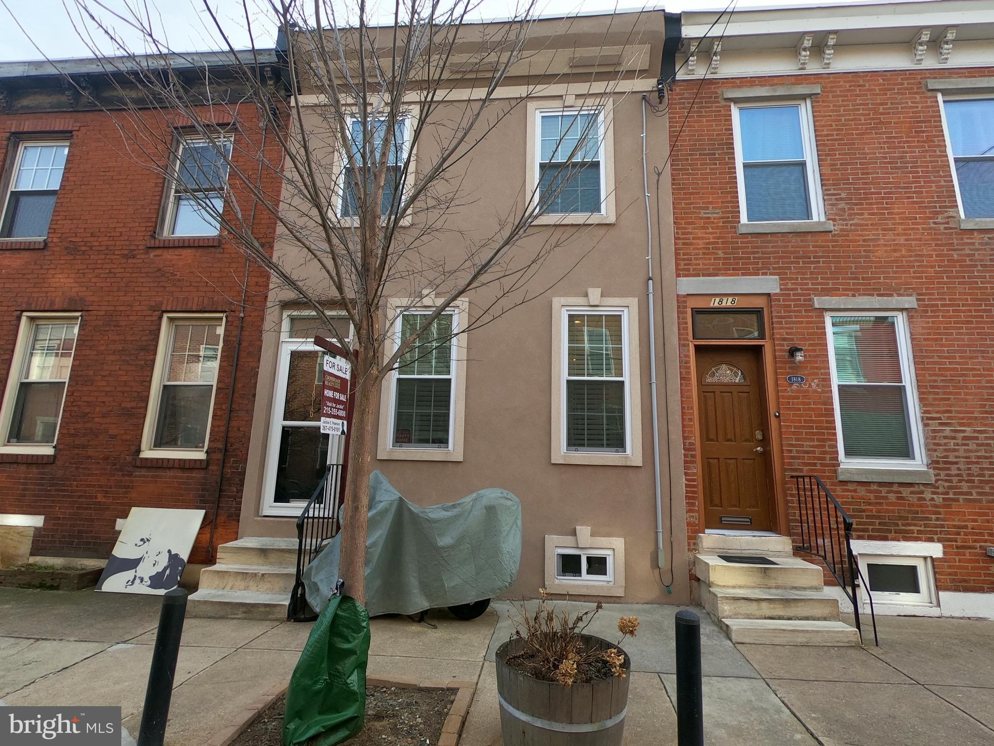 Beautifully maintained new construction from 2013. If you are looking for a prime location in popular Point Breeze, this is the home for you! 2 Bedroom, 2.5 Bathrooms, 16' wide, hardwood floors throughout, granite countertops in the kitchen that lead to the spacious cemented backyard with plenty of room for a grill and outdoor entertaining.  Finished basement that adds another 300 SqFt of living or storage space. The best kept secret of this house is the fiberglass roof-deck with a city skyline view. This house and location is a must see. On street parking. Tax Abatement. DON'T MISS OUT!!!