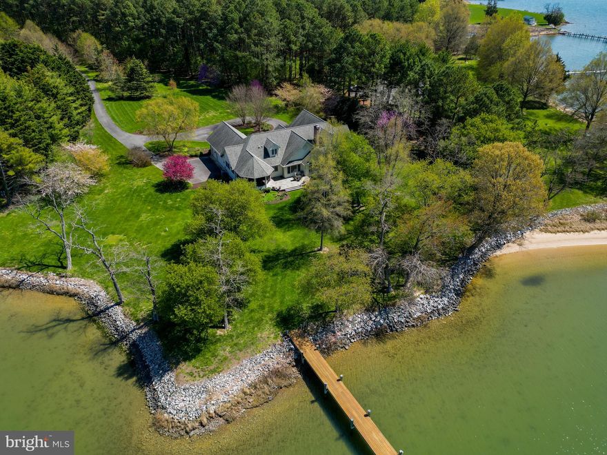 Exceptionally maintained 4 acre home situated on Plaindealing Creek with coveted western exposure and deep water dockage, 5+ MLW at private 6' wide pier with electric and water. Approximately 350 ft of rip-rapped shoreline and the well-manicured grounds are more like a private park with carefully chosen annuals and trees that provide blooms throughout the year.  This custom-built, single-level brick home designed by Linda Spring, features formal living and dining areas, bonus room, as well as waterside family room, office/den, primary suite with massive walk-in closet and spa-like bath, and an ample kitchen with island and table space.  Screened porch is perfect for enjoying the colorful sunsets or hosting a traditional Eastern Shore crab feast.  Centrally located between St. Michaels and Easton, it's the perfect place to get away from it all, yet enjoy being just minutes to dining, shopping, entertainment, golf, and more!
