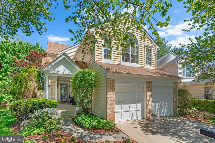 This beautiful home offers the perfect blend of charm, space, and functionality in a peaceful neighborhood. Set on a quiet cul-de-sac, the home features a large, shaded front porch—ideal for relaxing with a cup of coffee or enjoying warm summer evenings. Step inside to a welcoming entryway that opens to a thoughtfully designed first floor filled with natural light, open sightlines, and a spacious layout perfect for entertaining. The formal living and dining rooms flow seamlessly into the heart of the home: an expansive kitchen and family room with vaulted ceilings and a cozy fireplace. The kitchen is a chef’s dream with abundant counter space, modern appliances, a central island, and both a breakfast bar and an eat-in area with sliding doors leading to a private patio—just right for morning coffee or quiet moments. The family room, anchored by a fireplace and illuminated by a skylight, offers direct access to a generous back deck that overlooks a network of quaint neighborhood paths. Whether hosting a dinner party or enjoying a quiet evening, the first floor delivers exceptional space and flexibility, including a convenient powder room. Downstairs, the walk-out basement is a true bonus—featuring a large rec room with big windows for natural light, access to a backyard patio, and a huge storage area with laundry. Upstairs, you’ll find four spacious bedrooms and two full bathrooms. The primary suite is a tranquil retreat with large windows, a walk-in closet, and an en suite bath with a double vanity and soaking tub. The three additional bedrooms offer great closet space and share a full hallway bath, along with generous linen storage. A two-car garage provides additional storage and completes the home’s exceptional layout. With multiple outdoor entertaining spaces—including the front porch, side patio, basement walkout, and back deck—you’ll enjoy effortless indoor/outdoor living year-round. All of this is nestled in a vibrant neighborhood with walking paths, sidewalks, and easy access to a recreational park, tennis courts, playground & access to any Montgomery Village pool just minutes away.