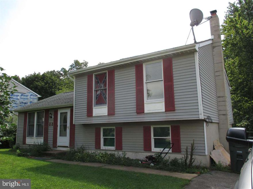 Solid, split-lvl hm has loads of potential, but is in need of cosmetic repairs.  Bring your tools & make it shine again.  Hm was a 3BR; Seller removed a wall to make a large rm   can easily be converted back.