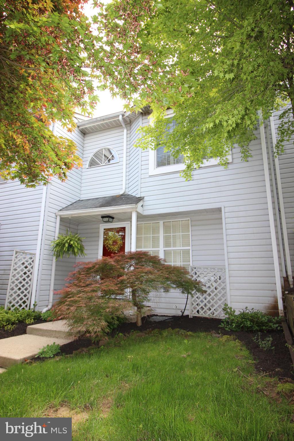 Beautiful Timber Ridge Townhouse.   2 Story.    2 Bedroom 1.5 Bath.  Beautiful fireplace.    Full walk out basement partially finished and sliding glass doors to patio.     Dining room has sliding glass doors to deck.    Open 2 story foyer with newer cable railings.  Laundry area on second floor.  Pull down stairs to attic for storage     *******   ALL OFFERS NEED TO BE IN BY MIDNIGHT 5-13-2023 ****