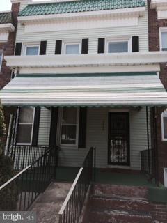 JUST REDUCED! 4 bedroom, 2 bath townhouse. Front porch with stairs and ramp. Well maintained with 4 bedrooms upstairs. Large living room, separate dining room, bright kitchen with ample cabinet space. Basement is finished. Home is clean and move in ready. Could be updated by a new owner or great investor opportunity. Sold "as is"