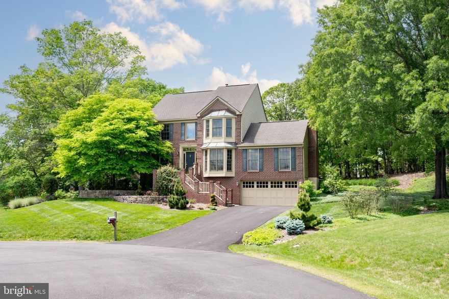 Welcome Home – it’s simply GORGEOUS! This home looks like a castle! It’s nestled on a pristine cul-de-sac, ¾ acre lot in the charming Gate Post Estates Community. I am pleased to introduce your new home by welcoming you into the grand foyer that showcases a stained-glass window created by a local artist. It also boasts a Craftsman inspired Grand Staircase & large chandelier. The main level features beautiful Brazilian cherry hardwood floors & Plantation Shutters. Now let’s open the French Doors & step into the Study/Den. It’s very inviting w/ a large Bay window & built-in shelving on either side of the doors to display your treasures! It’s also light & bright and perfect for those that need a private place to work from home! The Formal Living Room & Dining Rooms are large in size. The Baby Grand Piano “can convey”. The Dining Room also features a Bay window with serene views of the property. The Craftsman Inspired Gourmet Kitchen is a Chef/Baker’s dream come true! Featuring; GE Monogram stainless steel appliances. It’s equipped w/ a professional grade, dual fuel 36” 6 - Burner Gas Range/Oven with hood – it’s an amazing baking oven! Also, a Bosch Dishwasher, cherry cabinets, granite counter tops, pendant lights, a coffee/wine bar accented with glass cabinet doors, pantry, & slate/stone flooring. The breakfast area is multi-functional! It’s adorned with Marvin Windows & gorgeous views of the property. This space is charming & cozy! It’s perfect for meals together or simply to enjoy a cup of coffee or a glass of wine! It’s truly a lovely spot to unwind! The family room/recreation room is just off the kitchen. This is the heart of the home! The wood-burning, brick fireplace is the focal point. It’s complimented w/ floor to ceiling built-in shelving on either side. Please take note of the wood flooring (In-Lay) accent detail. This room is also wired for 5.1 Audio. Moving on to the upper level – there are 4 bedrooms/2 full baths. The Primary Suite is large in size, & you will love the recently upgraded bath featuring a very beautiful stained-glass window (created by the same local artist for this space). Brand new carpet in all 4 bedrooms. Moving on with the tour to the lower level of this amazing home! The Theatre Room equipment (Denon Receiver w/ 5.1 sound system & Projector 4k & large movie Screen) “can convey"! The Basement Bath was just completed prior to listing & has never been used. The Workshop ceiling is brand new! The mud room just off the garage is a gem & so multi-functional! The lower-level space can be utilized in so many ways; theatre room, guest bedroom, home office, craft/hobby/work room, home gym, or anything that may work best for your needs. The oversized 2 car garage features a garden room to house all of your gardening tools. Let’s get excited for the ¾ acre property details; the paved patio is perfect for grilling & entertaining, retaining walls, mature trees, rose gardens, lovely flower beds, a screened Gazebo, trellis w/flowering vines, a permanent playhouse w/electricity, gorgeous landscaping, a long driveway pad, & a cul-de-sac.  This home is in the back of the community, it’s quiet & peaceful! Other exciting features of the home; 2 American Standards A/C units (1 dedicated for the upper level). Roof is 20 years into a 30-year warranty (recently inspected). 2022 Trane Furnace, 2021 AO Smith Hot Water Heater. The beautiful Gate Post Estates Community features walking trails, it's close to shopping, dining, vineyards/breweries. (8.8 miles) to VRE/Manassas. (14 miles) to Dulles Airport. (11 miles) to Vienna Metro. (1 mile) to Commuter Lot. Please schedule your private showing today to make this spectacular house your new home!